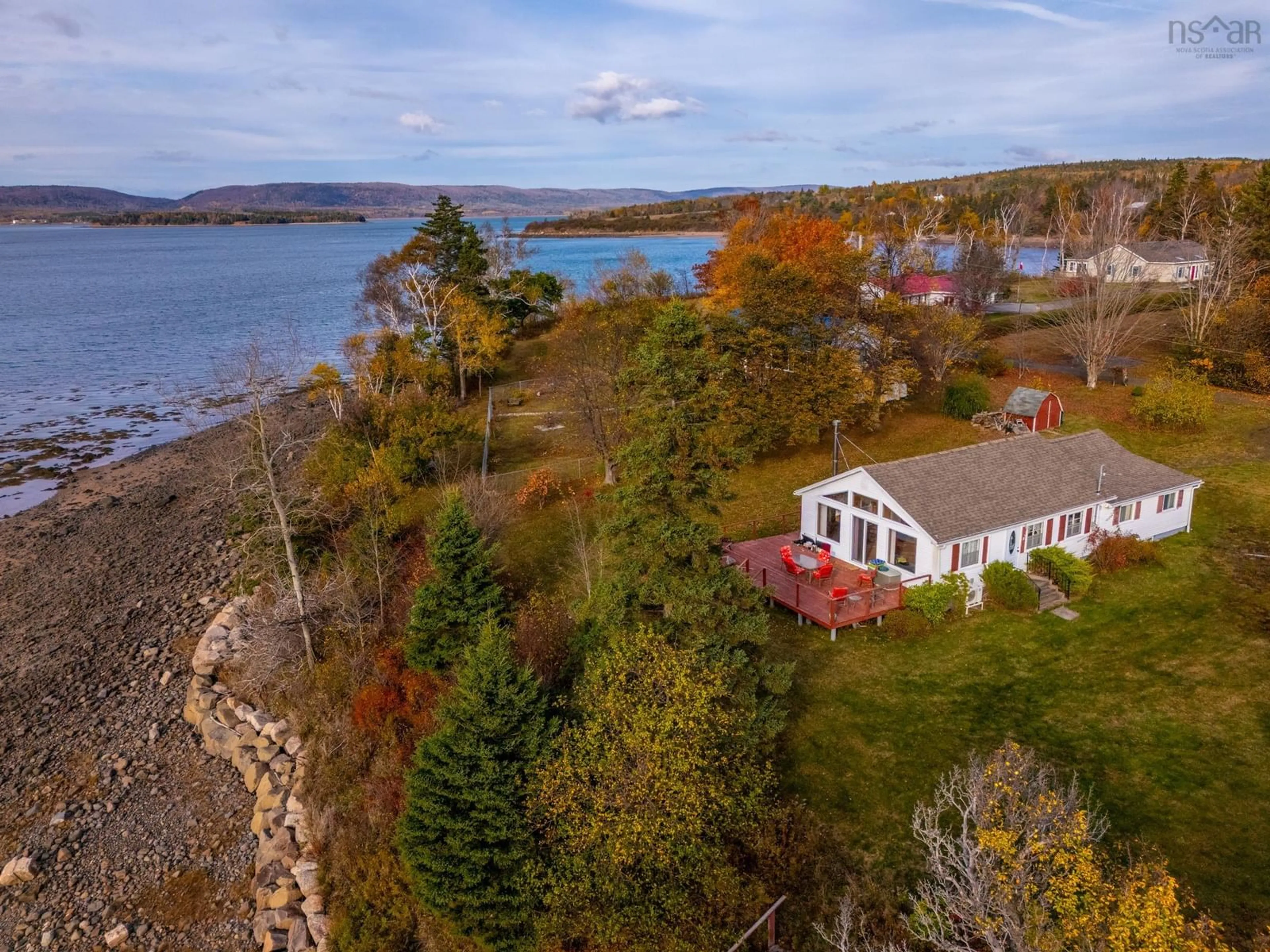 A pic from outside/outdoor area/front of a property/back of a property/a pic from drone, water/lake/river/ocean view for 55 White Cap Lane, Clementsport Nova Scotia B0S 1A0