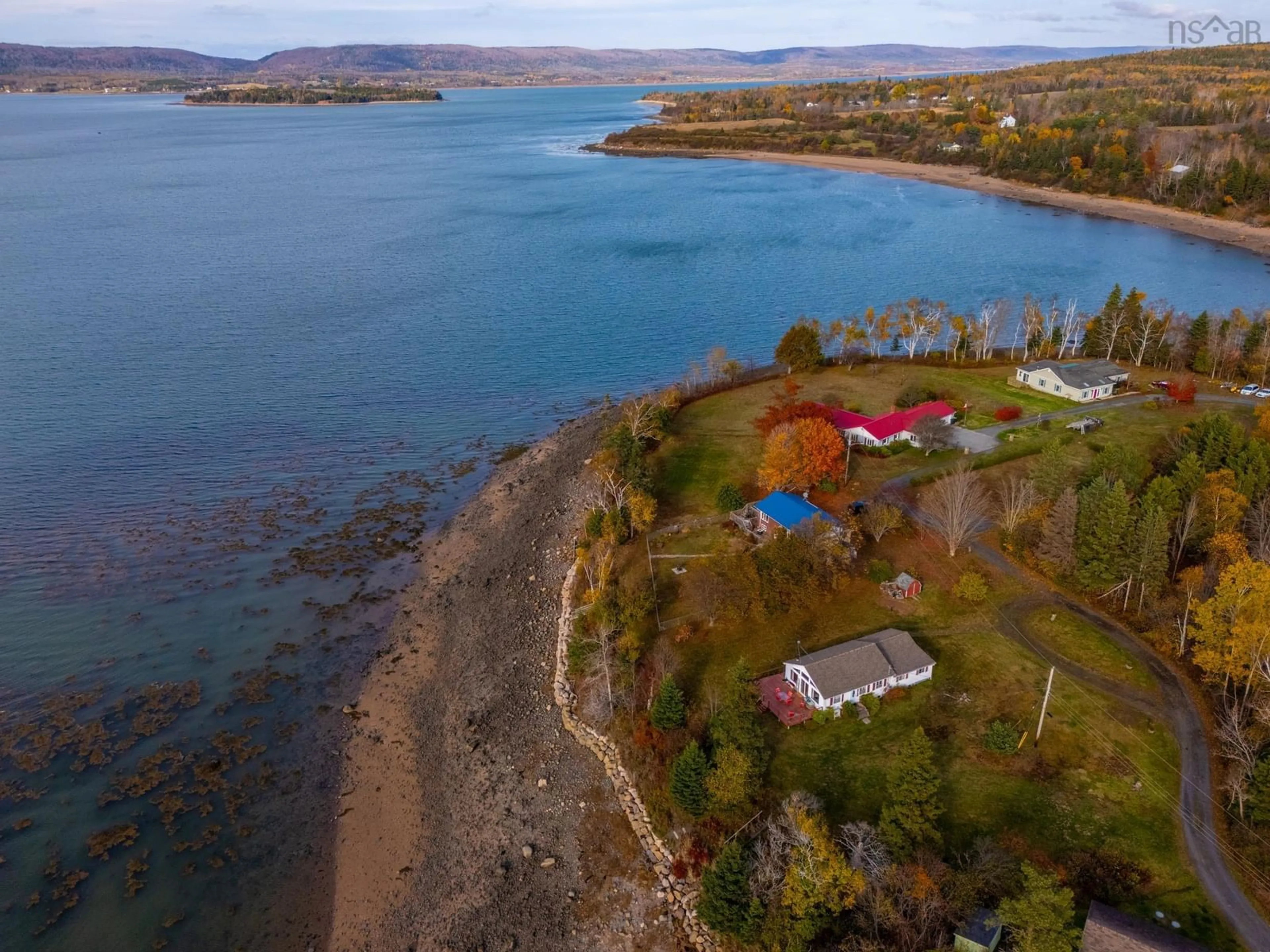 A pic from outside/outdoor area/front of a property/back of a property/a pic from drone, water/lake/river/ocean view for 55 White Cap Lane, Clementsport Nova Scotia B0S 1A0