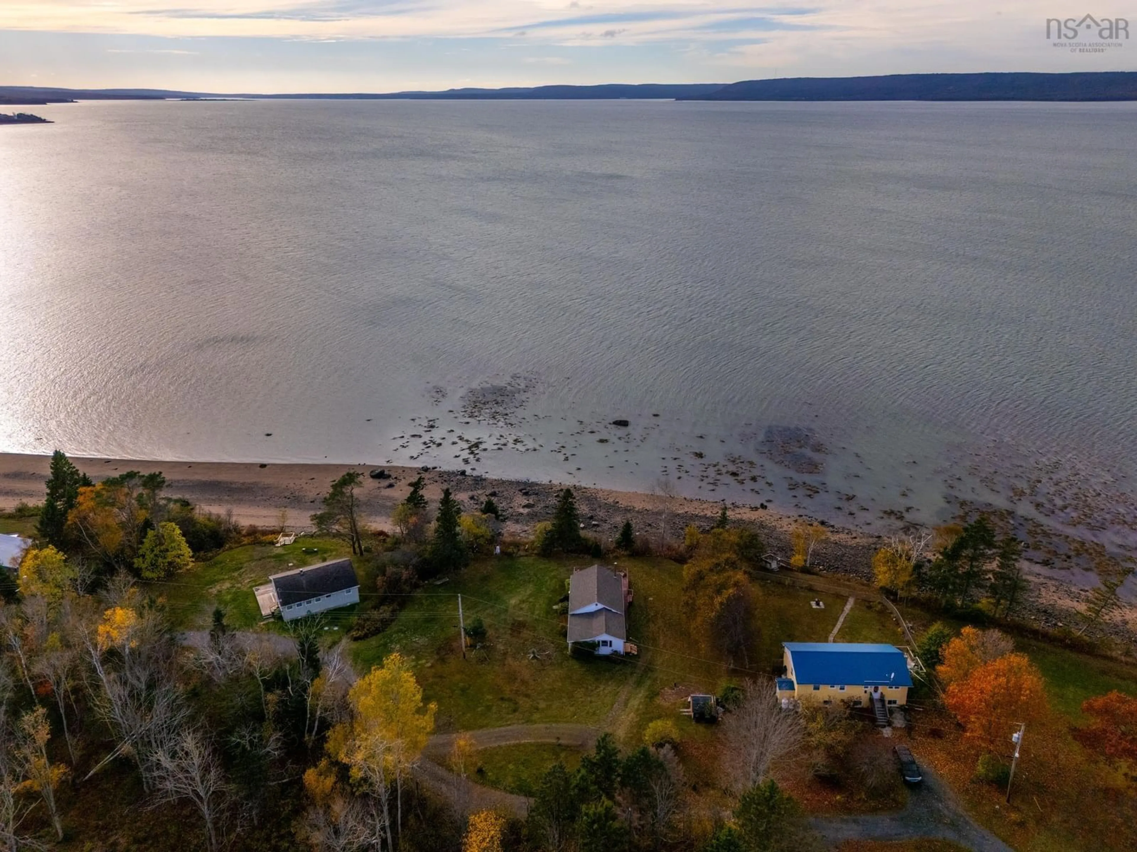 A pic from outside/outdoor area/front of a property/back of a property/a pic from drone, water/lake/river/ocean view for 55 White Cap Lane, Clementsport Nova Scotia B0S 1A0