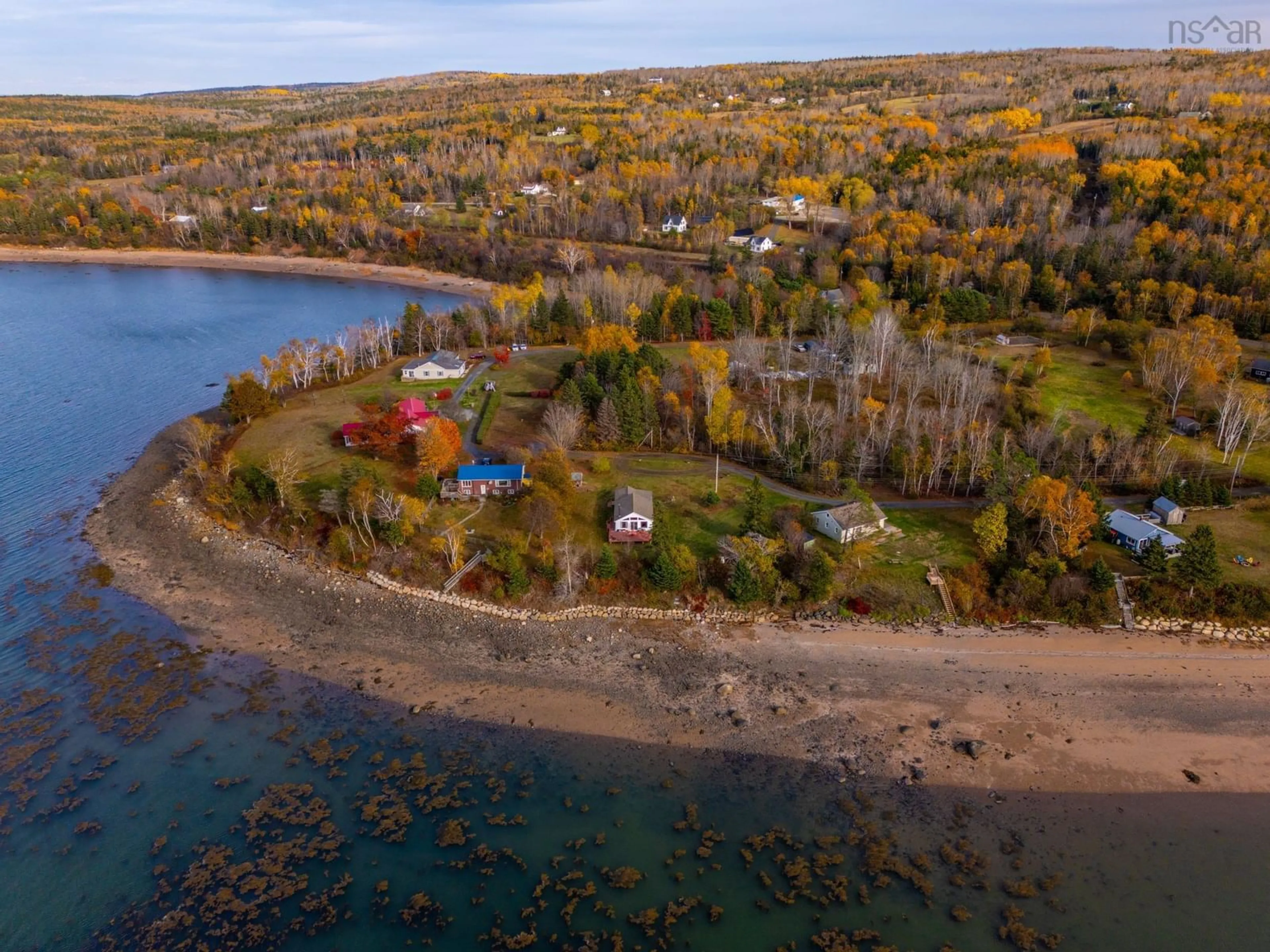 A pic from outside/outdoor area/front of a property/back of a property/a pic from drone, water/lake/river/ocean view for 55 White Cap Lane, Clementsport Nova Scotia B0S 1A0