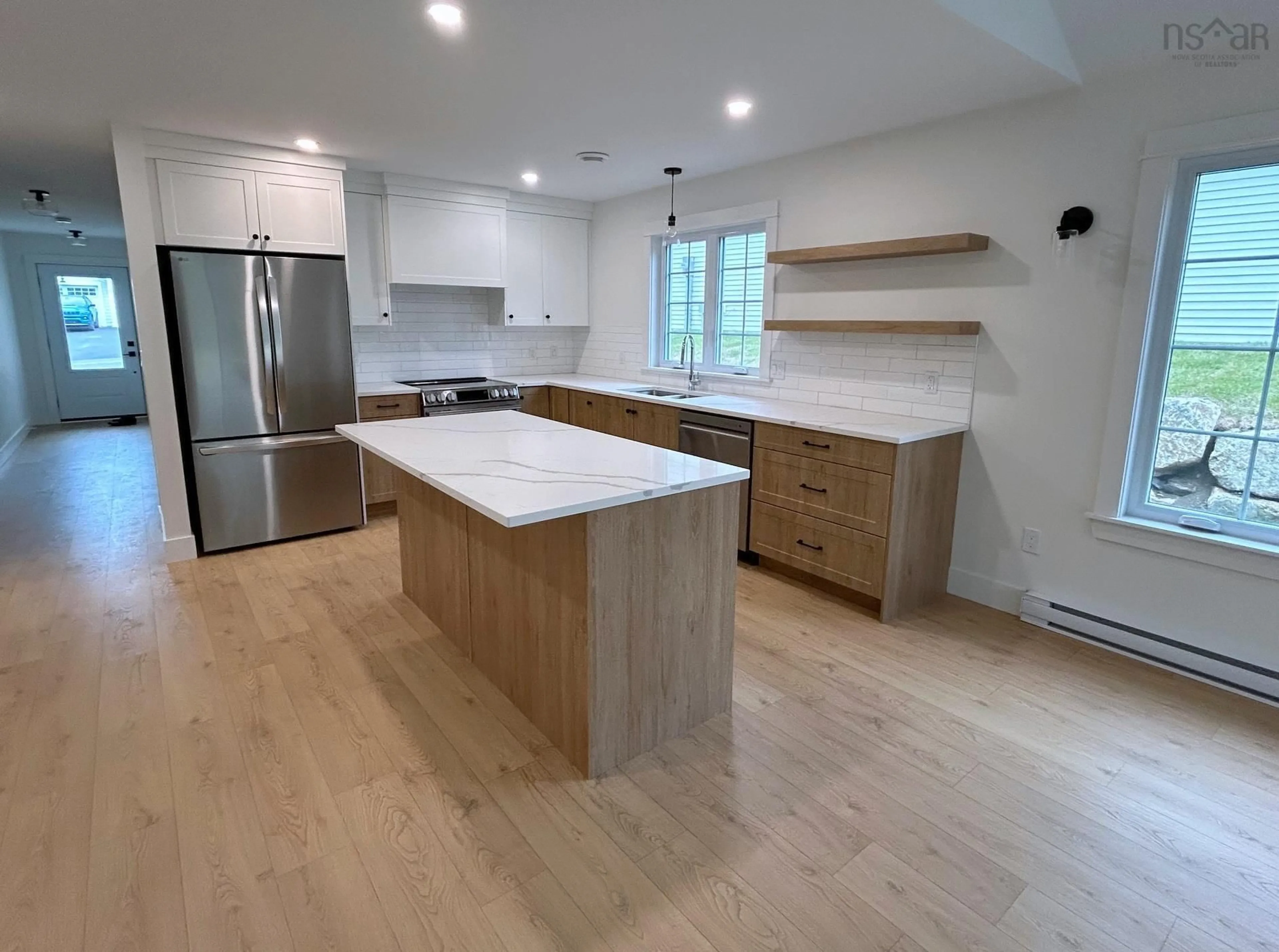 Open concept kitchen, wood/laminate floor for 14 Chester Hills Dr, Chester Nova Scotia B0J 1J0