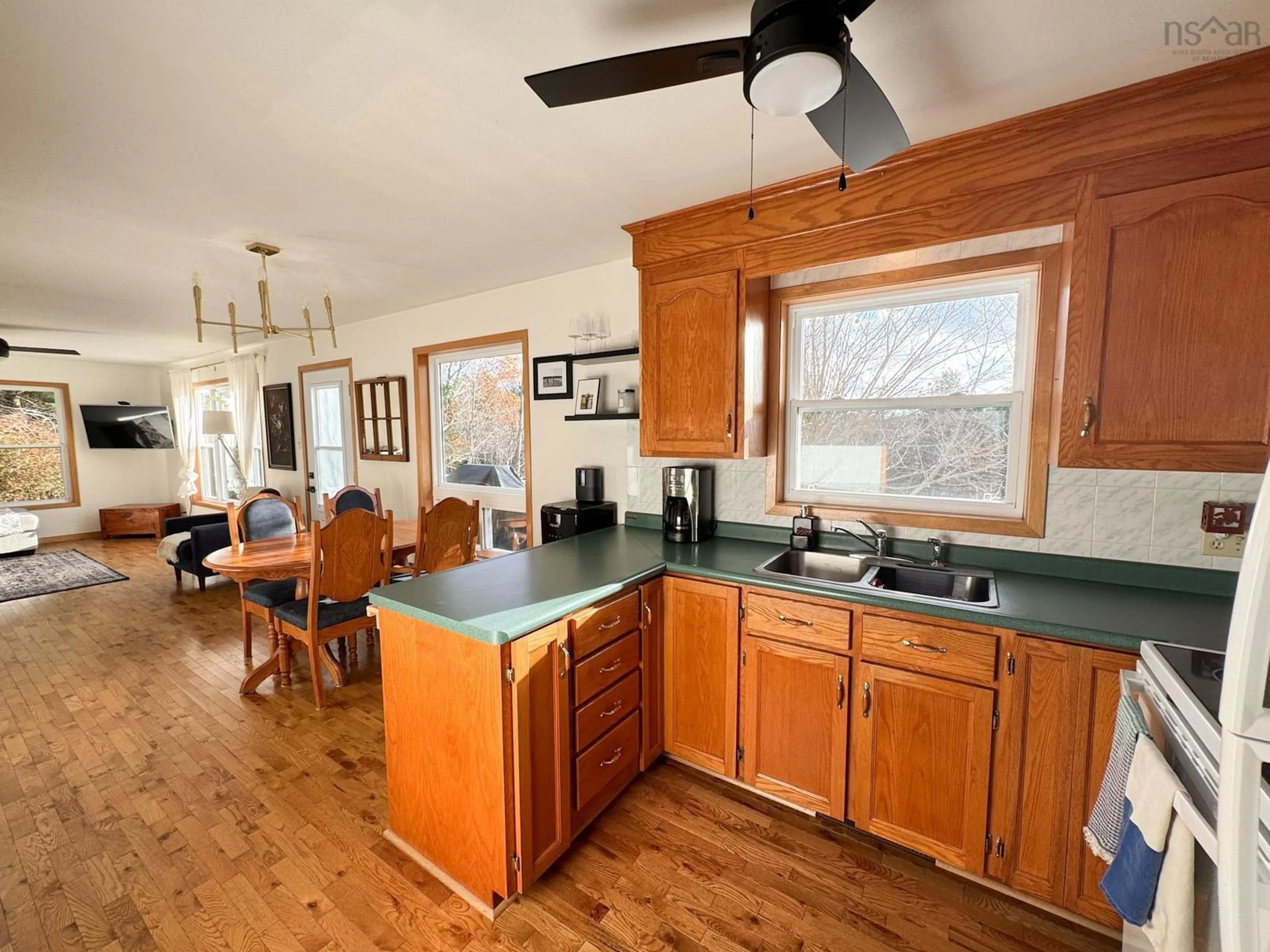 Open concept kitchen, wood/laminate floor for 9575 Highway 3 Rte, Maders Cove Nova Scotia B0J 2E0