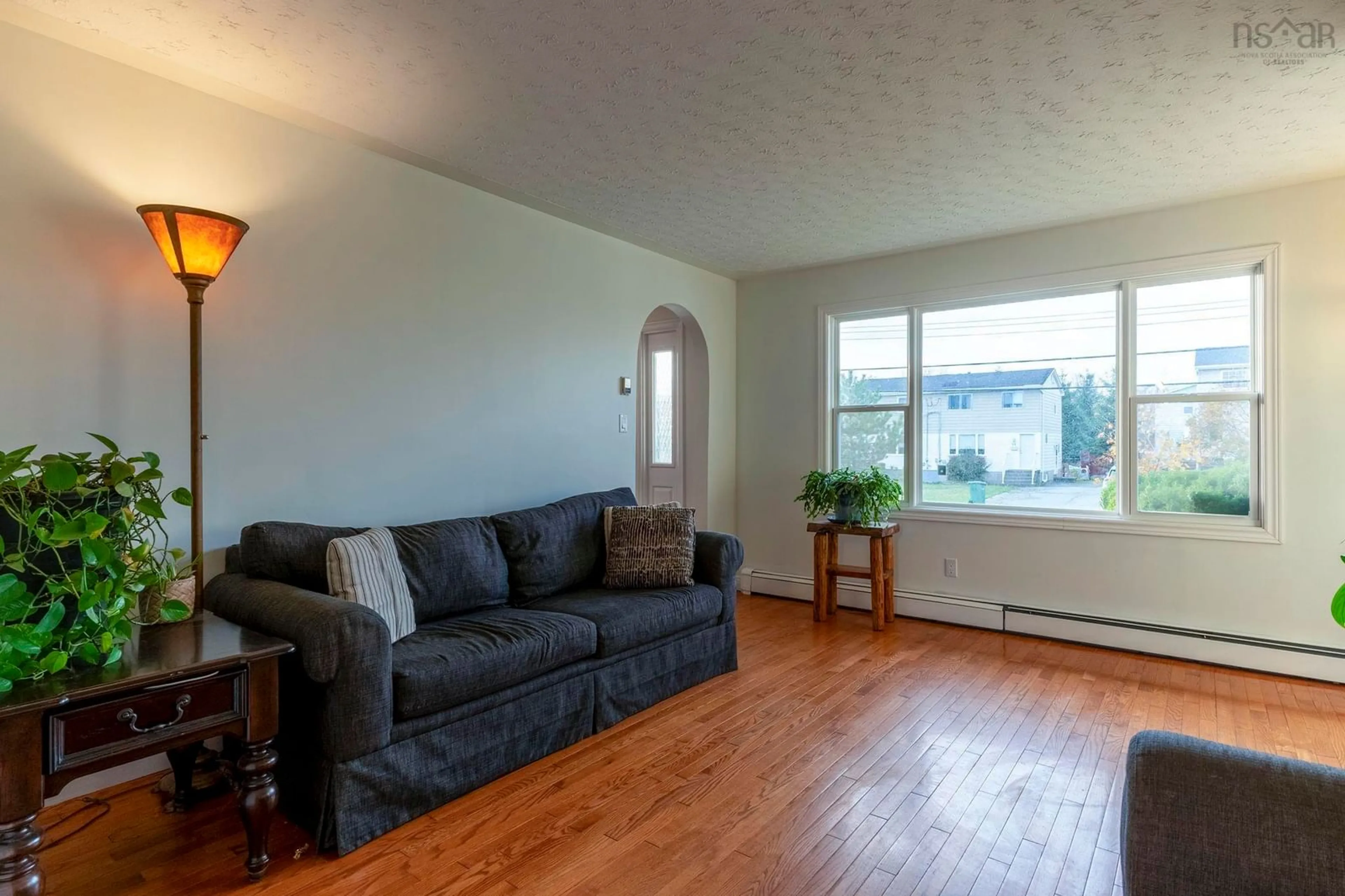 Living room with furniture, wood/laminate floor for 22 Carisbrooke Lane, Cole Harbour Nova Scotia B2V 1R2