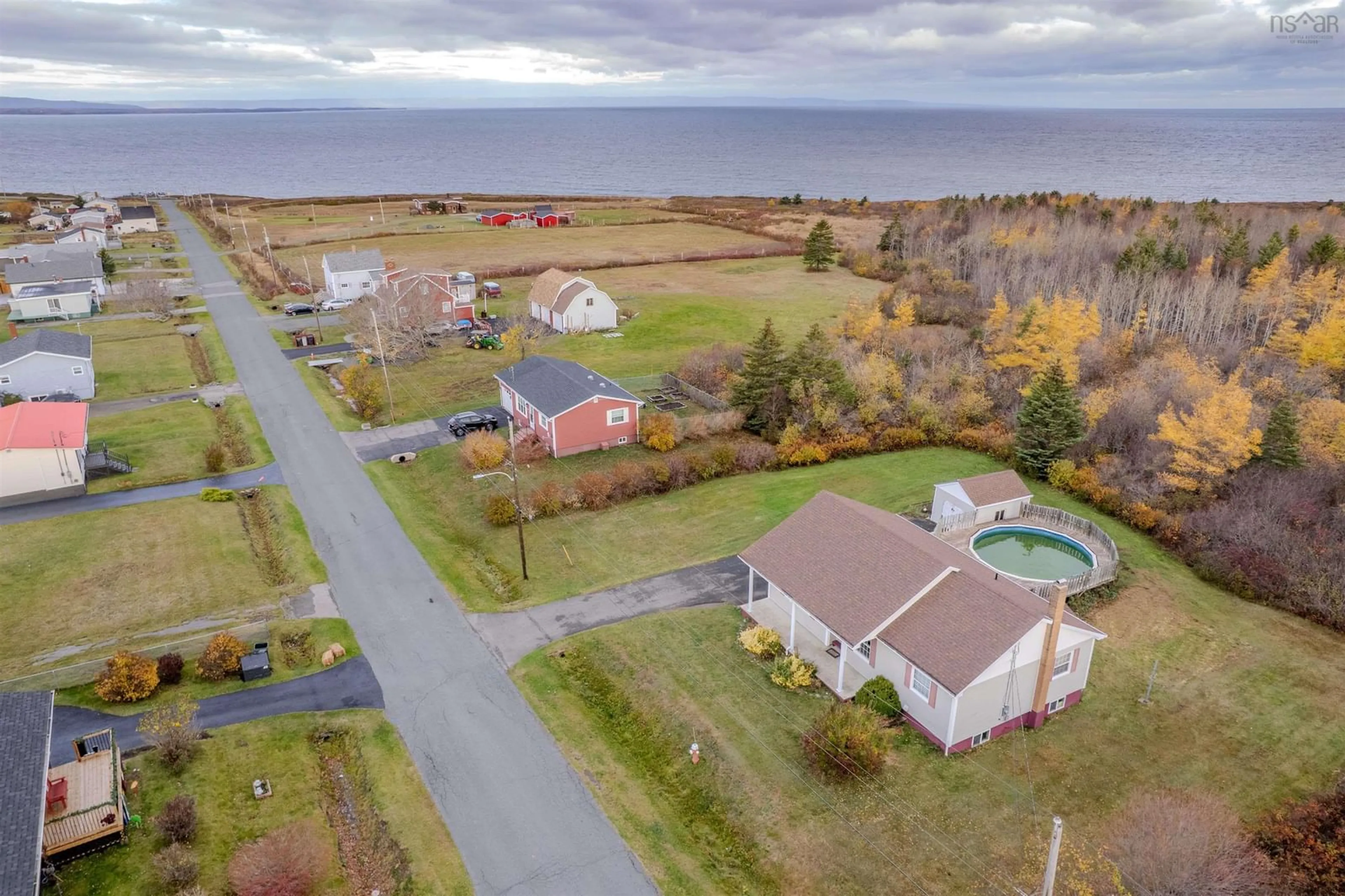 A pic from outside/outdoor area/front of a property/back of a property/a pic from drone, water/lake/river/ocean view for 47 Daley Rd, New Victoria Nova Scotia B1H 4Z5