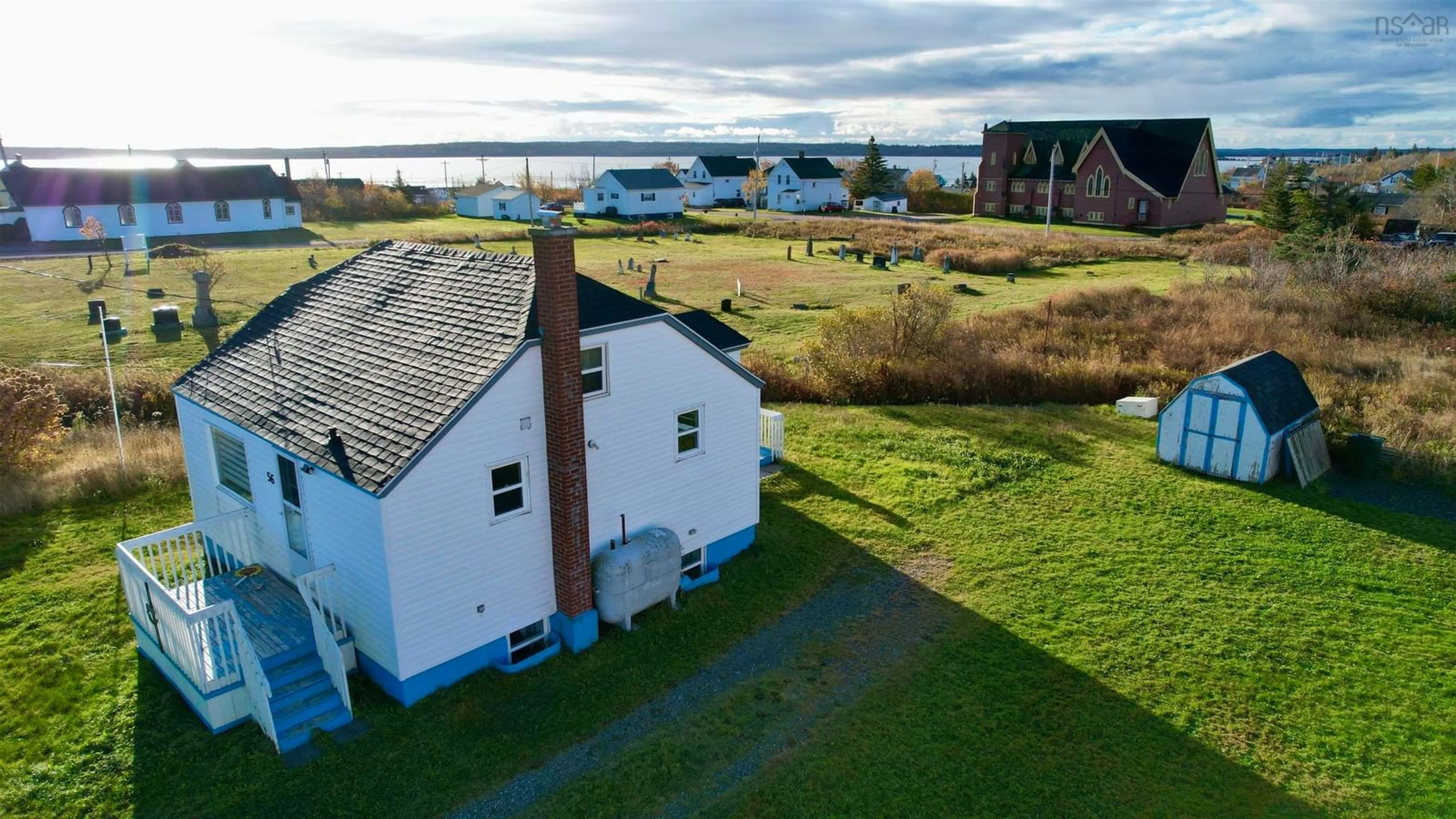 A pic from outside/outdoor area/front of a property/back of a property/a pic from drone, water/lake/river/ocean view for 56 Birch St, Port Morien Nova Scotia B1A 2M6