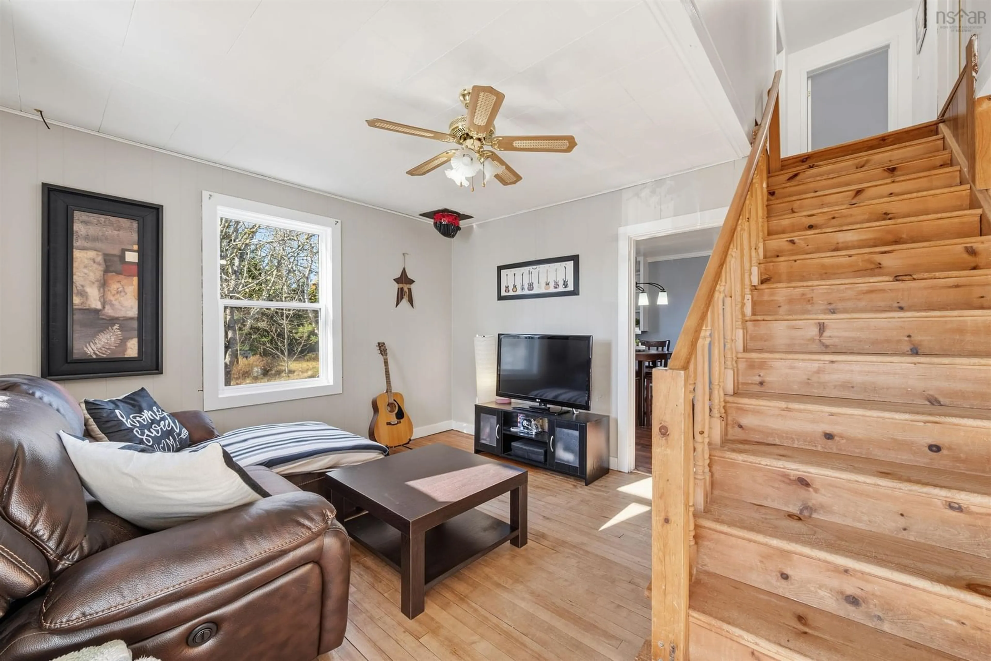 Living room with furniture, wood/laminate floor for 4597 Prospect Rd., Bayside Nova Scotia B3Z 1L8
