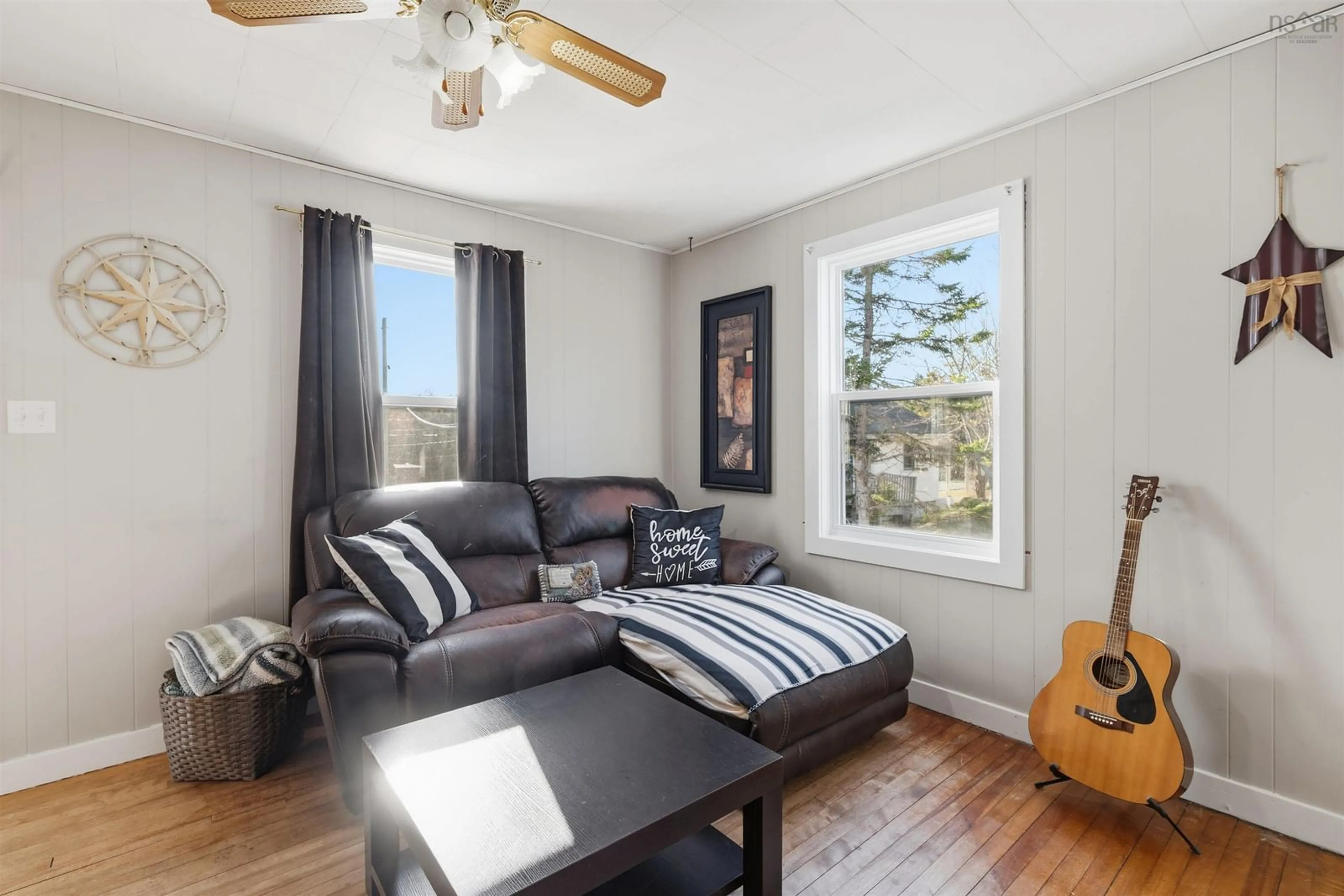 Living room with furniture, wood/laminate floor for 4597 Prospect Rd., Bayside Nova Scotia B3Z 1L8
