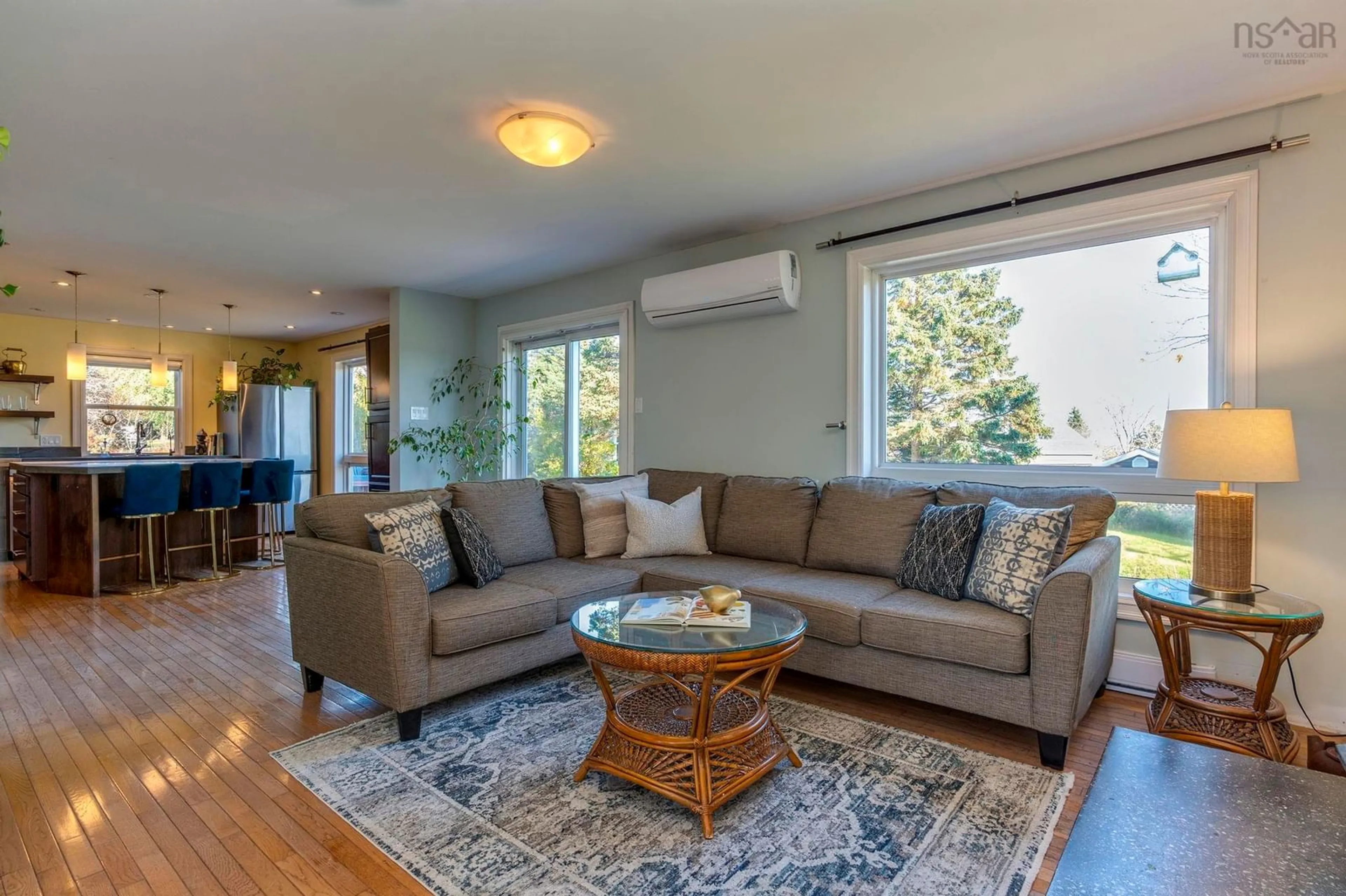 Living room with furniture, wood/laminate floor for 698 Ketch Harbour Rd, Portuguese Cove Nova Scotia B3V 1K2