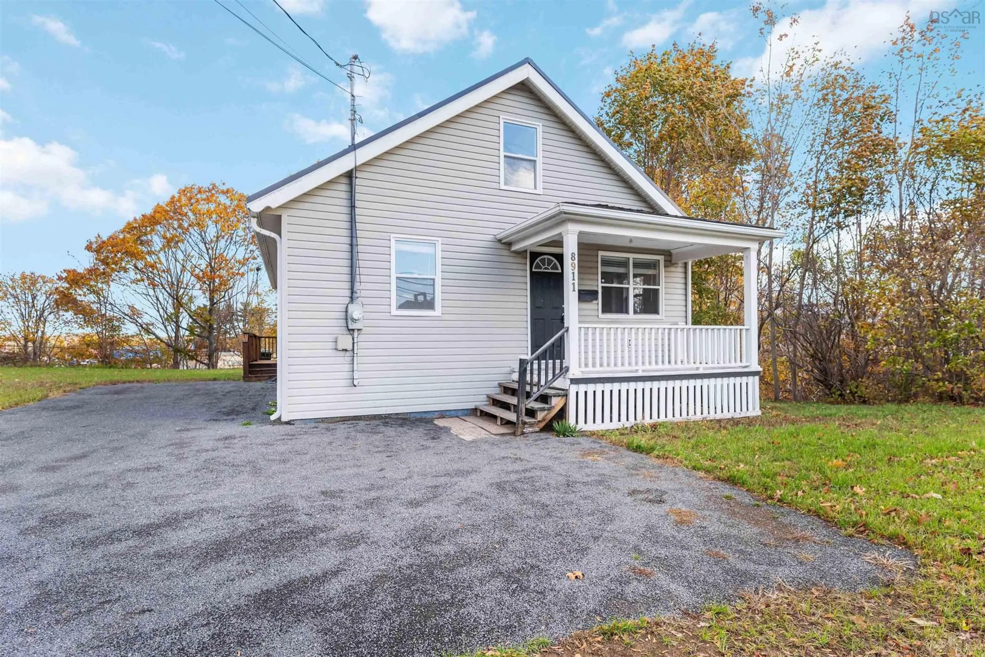 Home with vinyl exterior material, street for 8911 Commercial Street, New Minas Nova Scotia B4N 3E1