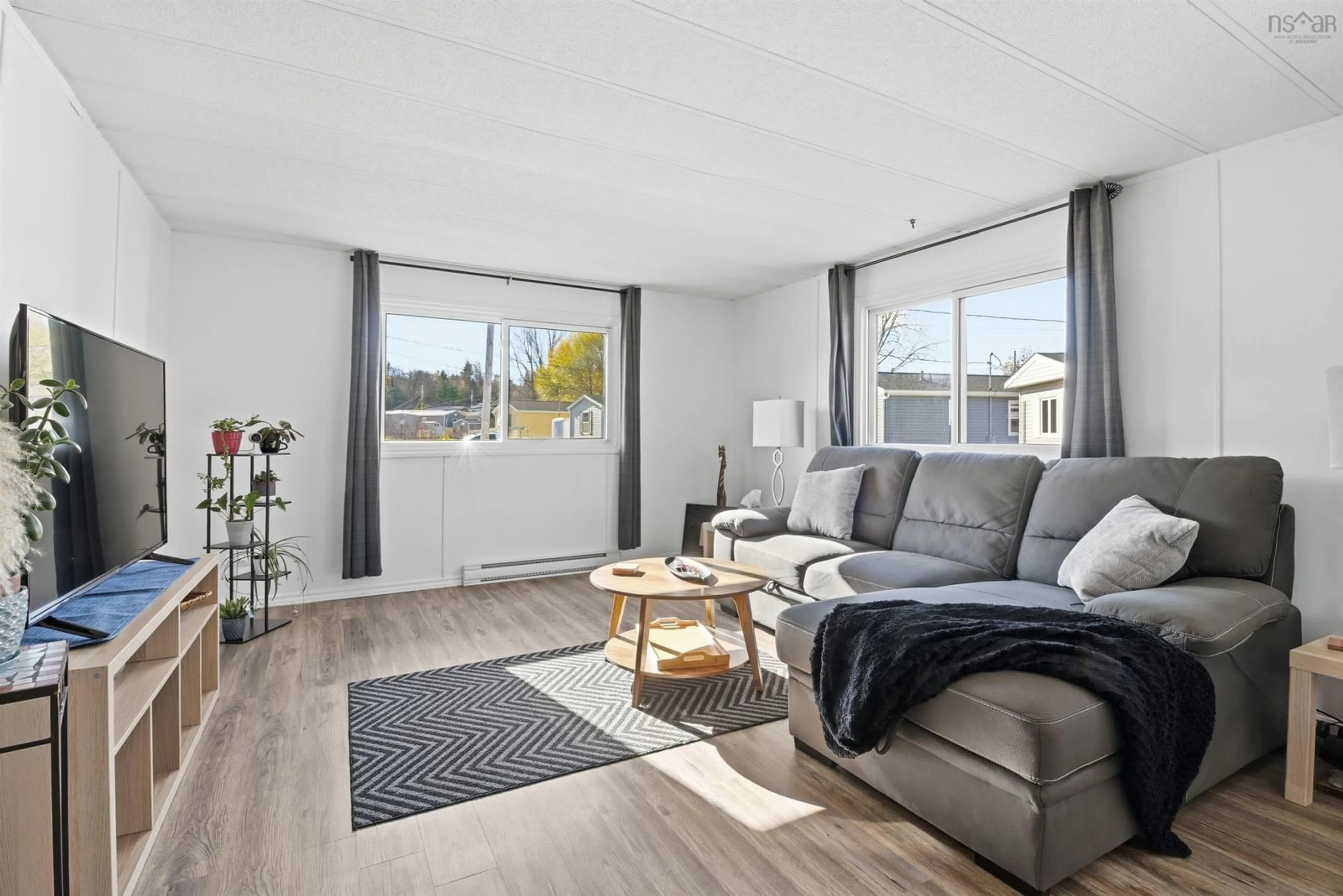 Living room with furniture, wood/laminate floor for 29 Brook Cres, Middle Sackville Nova Scotia B4E 1C3
