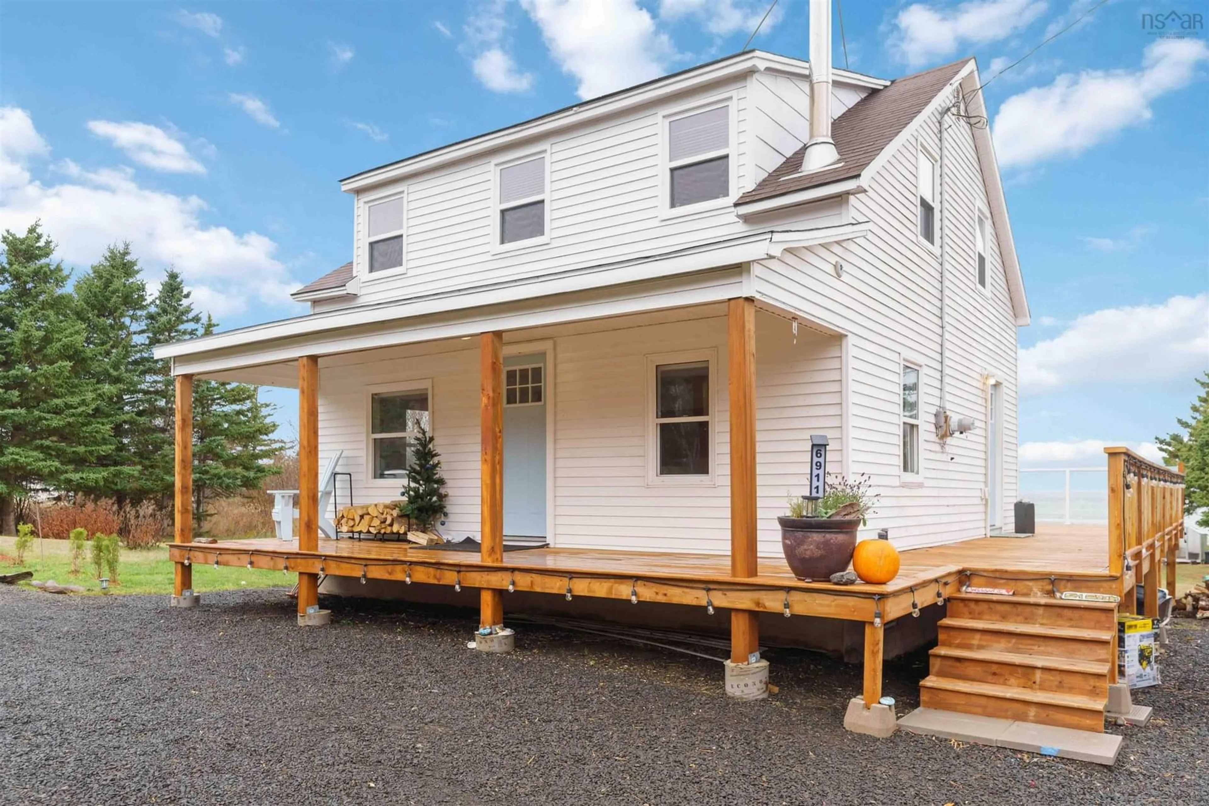 Home with vinyl exterior material, street for 6911 Shore Rd West Rd, Phinneys Cove Nova Scotia B0S 1L0