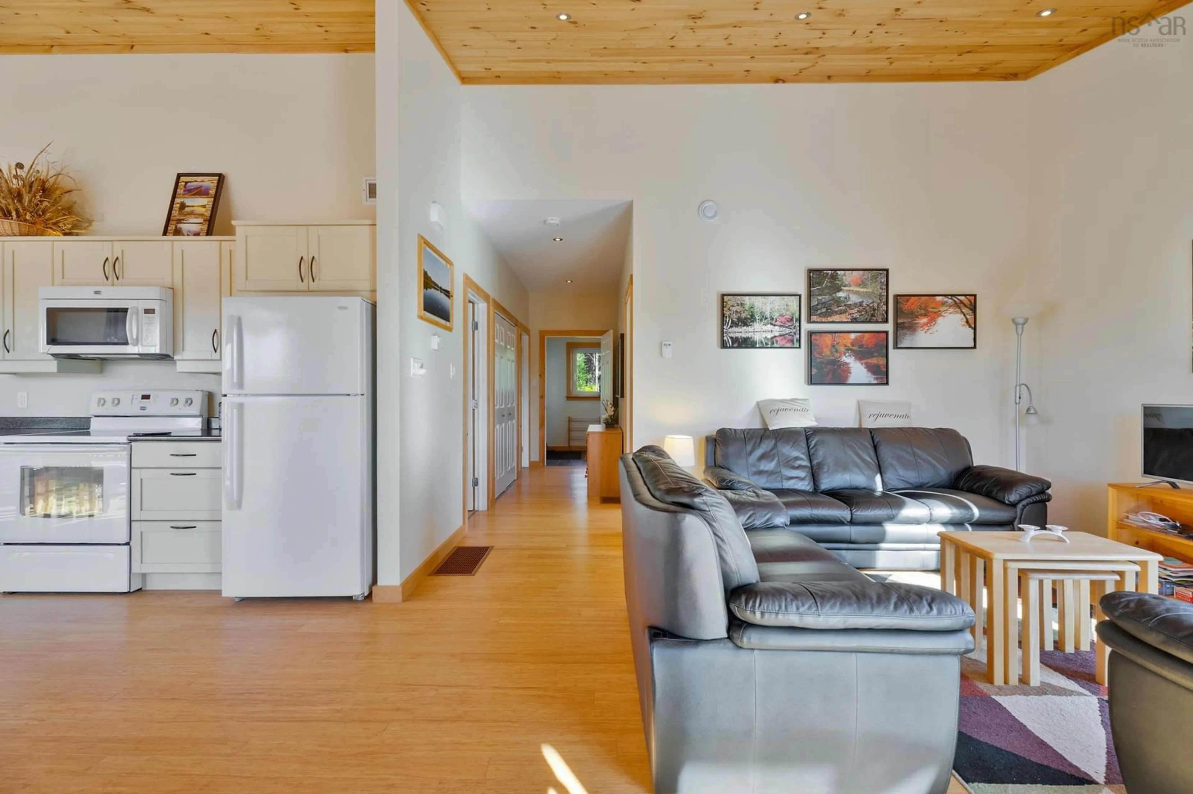 Living room with furniture, wood/laminate floor for 3143 Sonora Dr, Sherbrooke Nova Scotia B0J 3C0