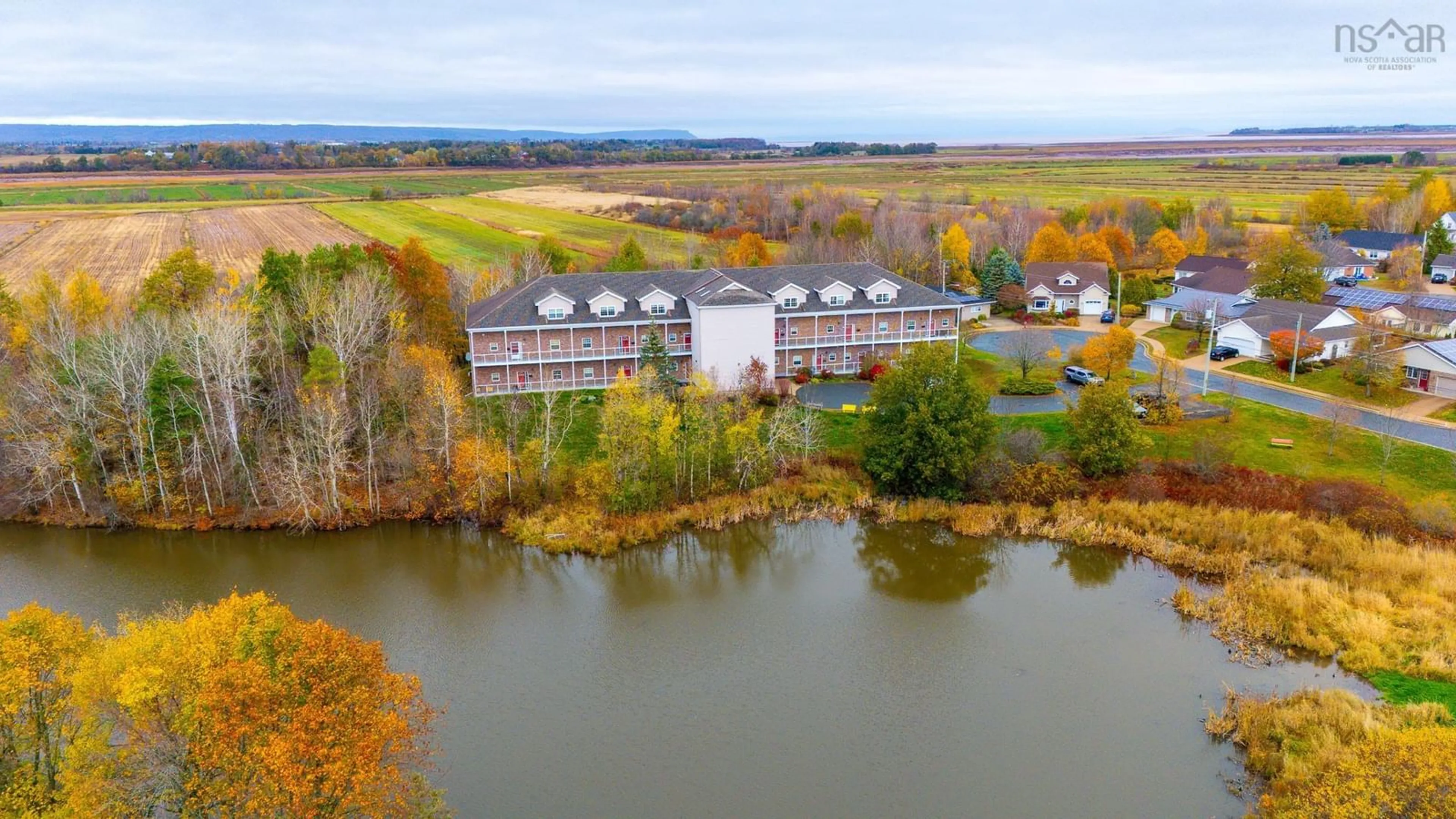 A pic from outside/outdoor area/front of a property/back of a property/a pic from drone, water/lake/river/ocean view for 71 Chambers Close #203, Wolfville Nova Scotia B4P 2S8