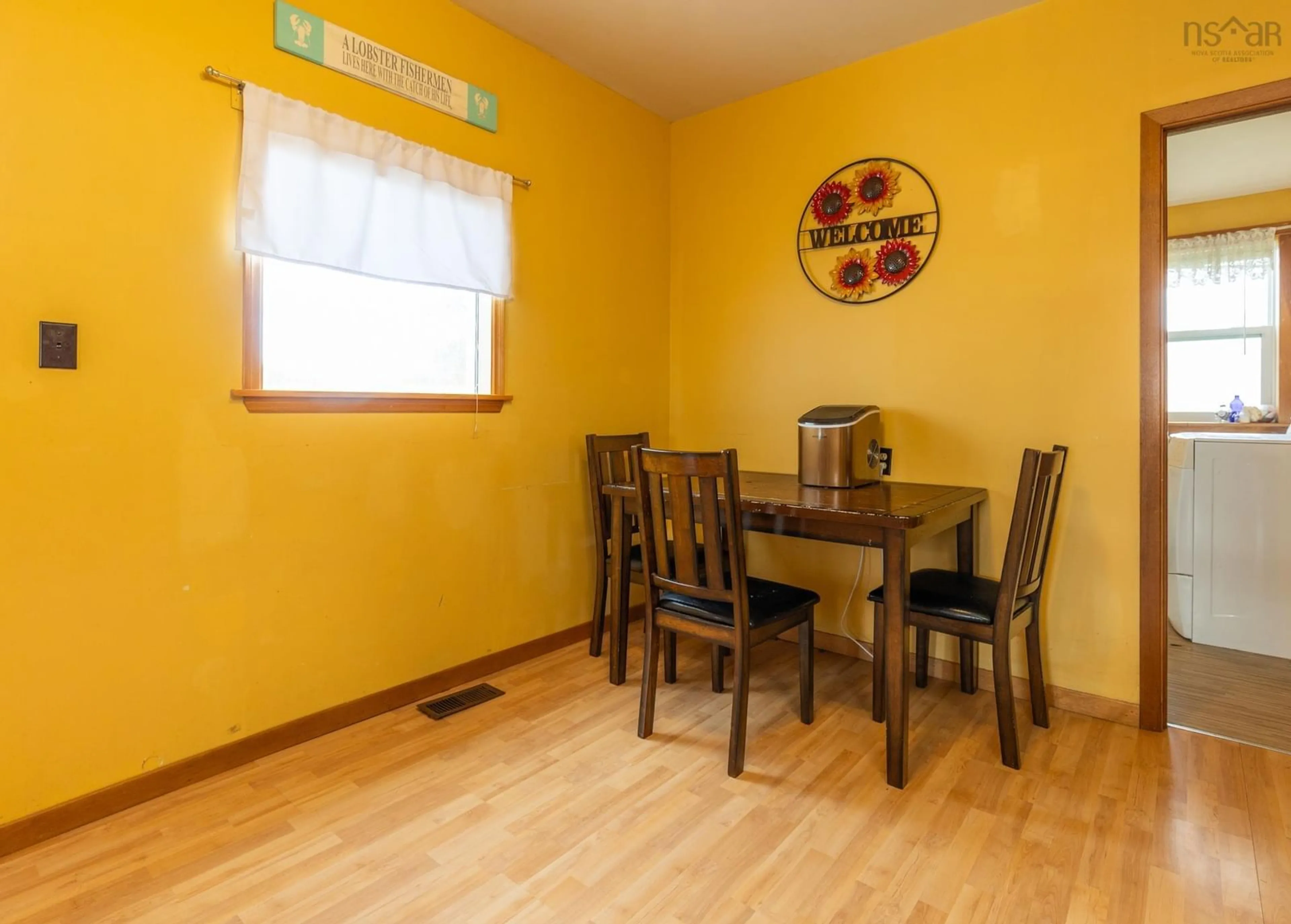 Dining room, wood/laminate floor for 5347 Highway 1, Salmon River Nova Scotia B5A 5B2