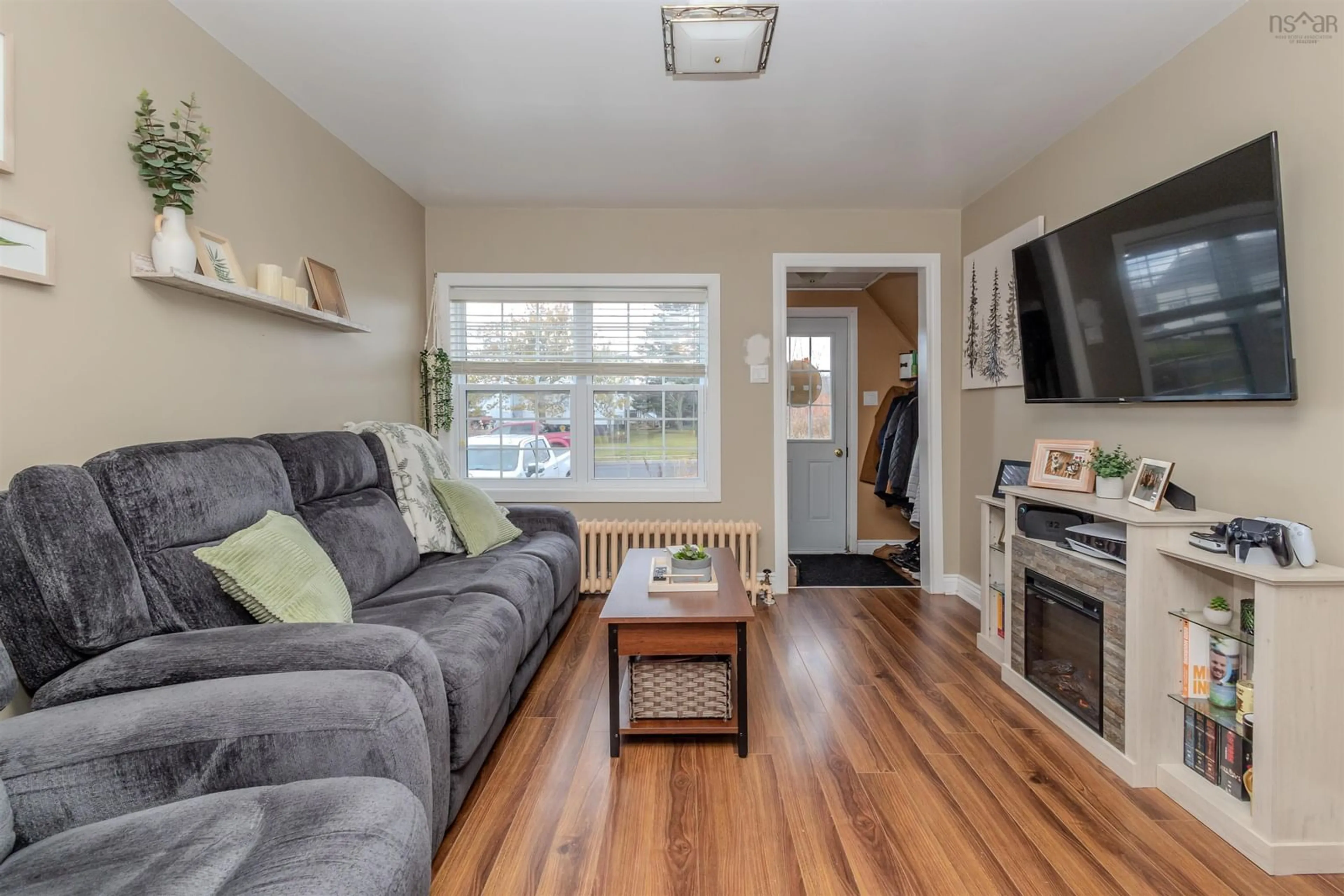 Living room with furniture, wood/laminate floor for 82 Beacon St, Glace Bay Nova Scotia B1A 5G4