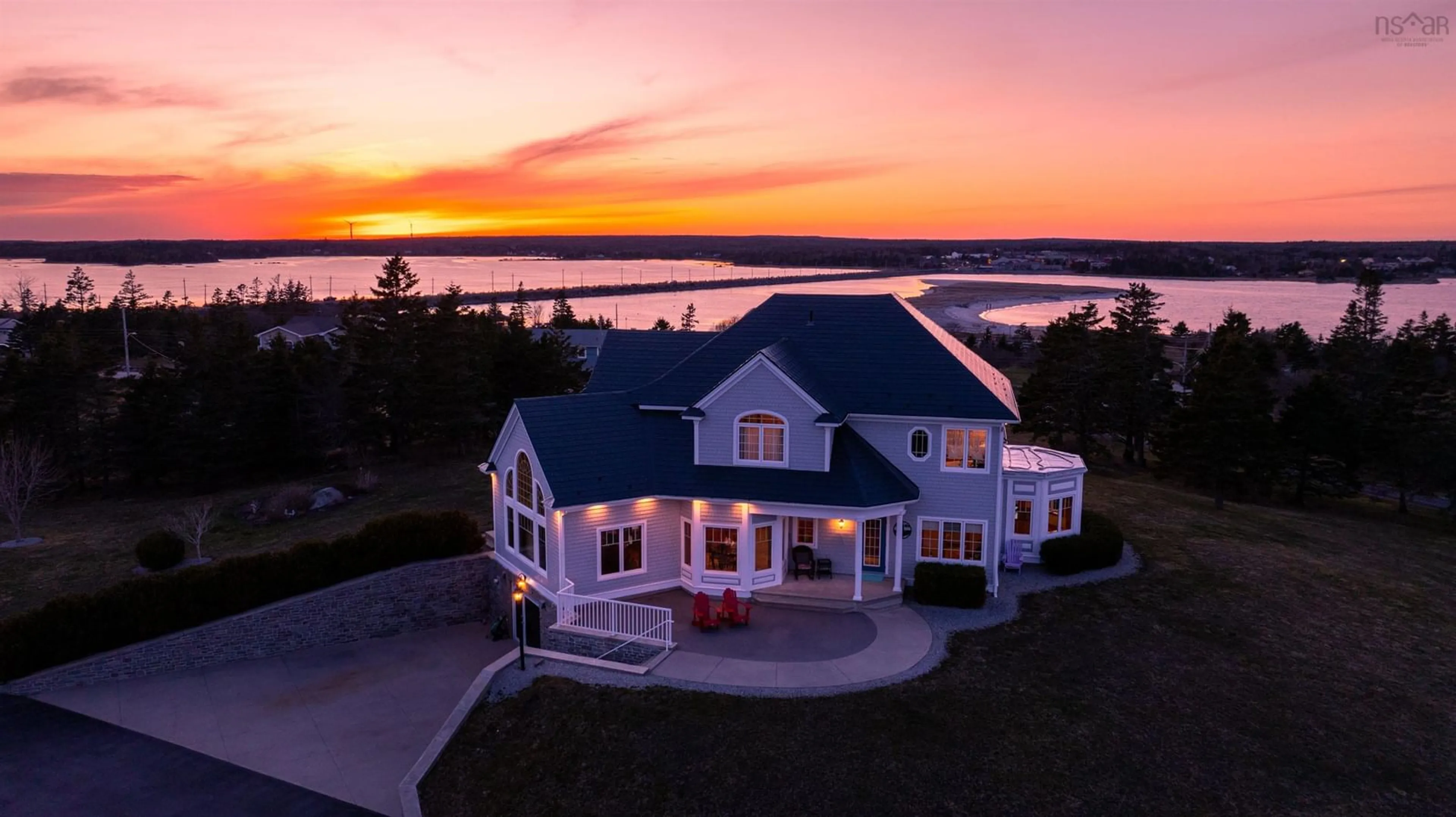 A pic from outside/outdoor area/front of a property/back of a property/a pic from drone, water/lake/river/ocean view for 101 Mcgray Ave, North East Point Nova Scotia B0W 2P0