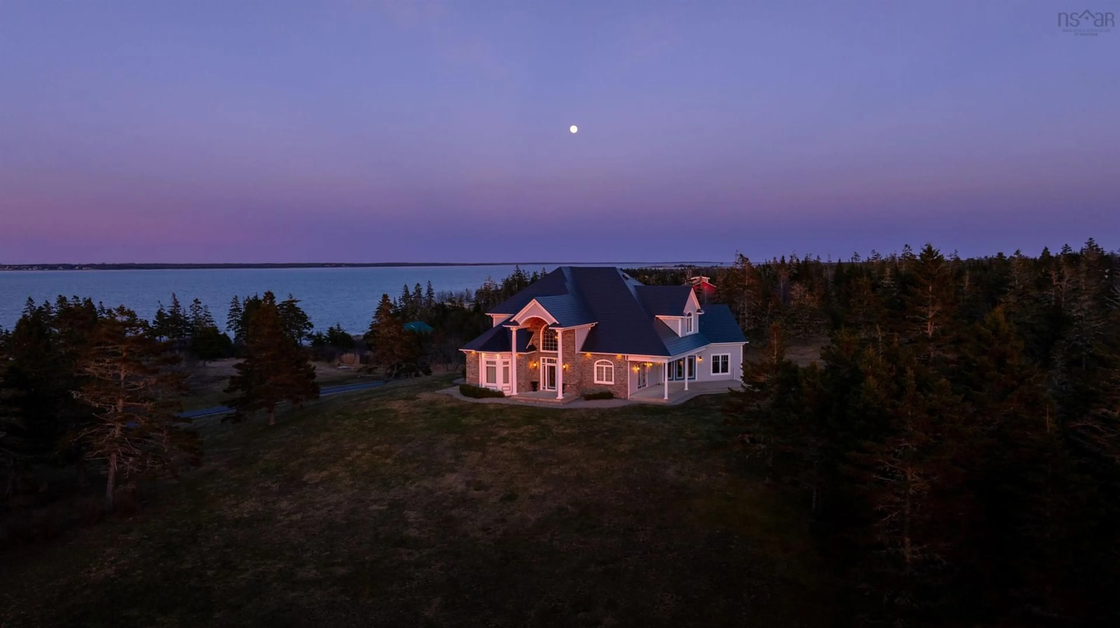 A pic from outside/outdoor area/front of a property/back of a property/a pic from drone, water/lake/river/ocean view for 101 Mcgray Ave, North East Point Nova Scotia B0W 2P0