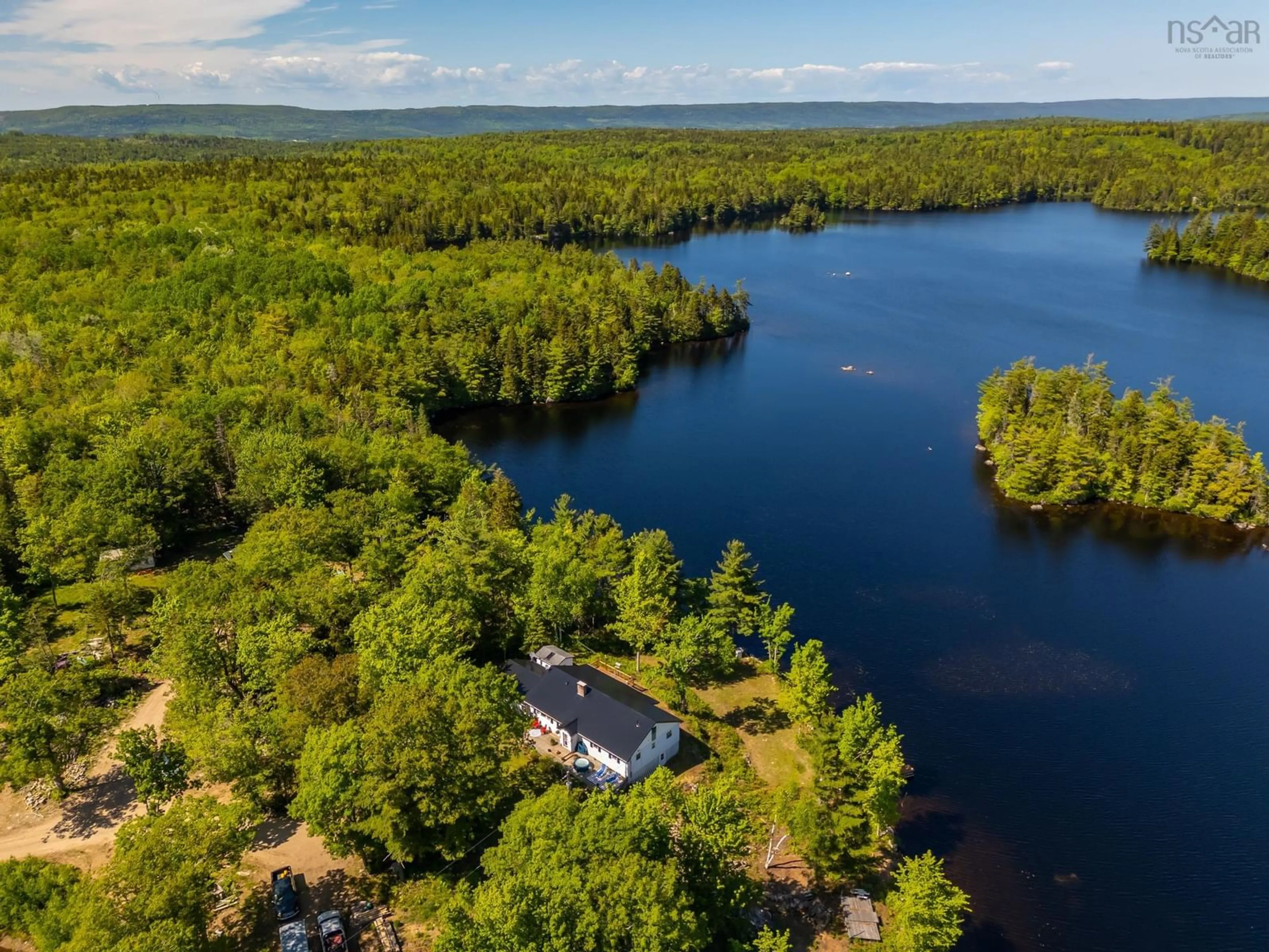 A pic from outside/outdoor area/front of a property/back of a property/a pic from drone, water/lake/river/ocean view for 31 Acorn Lane, Lake La Rose Nova Scotia B0S 1A0