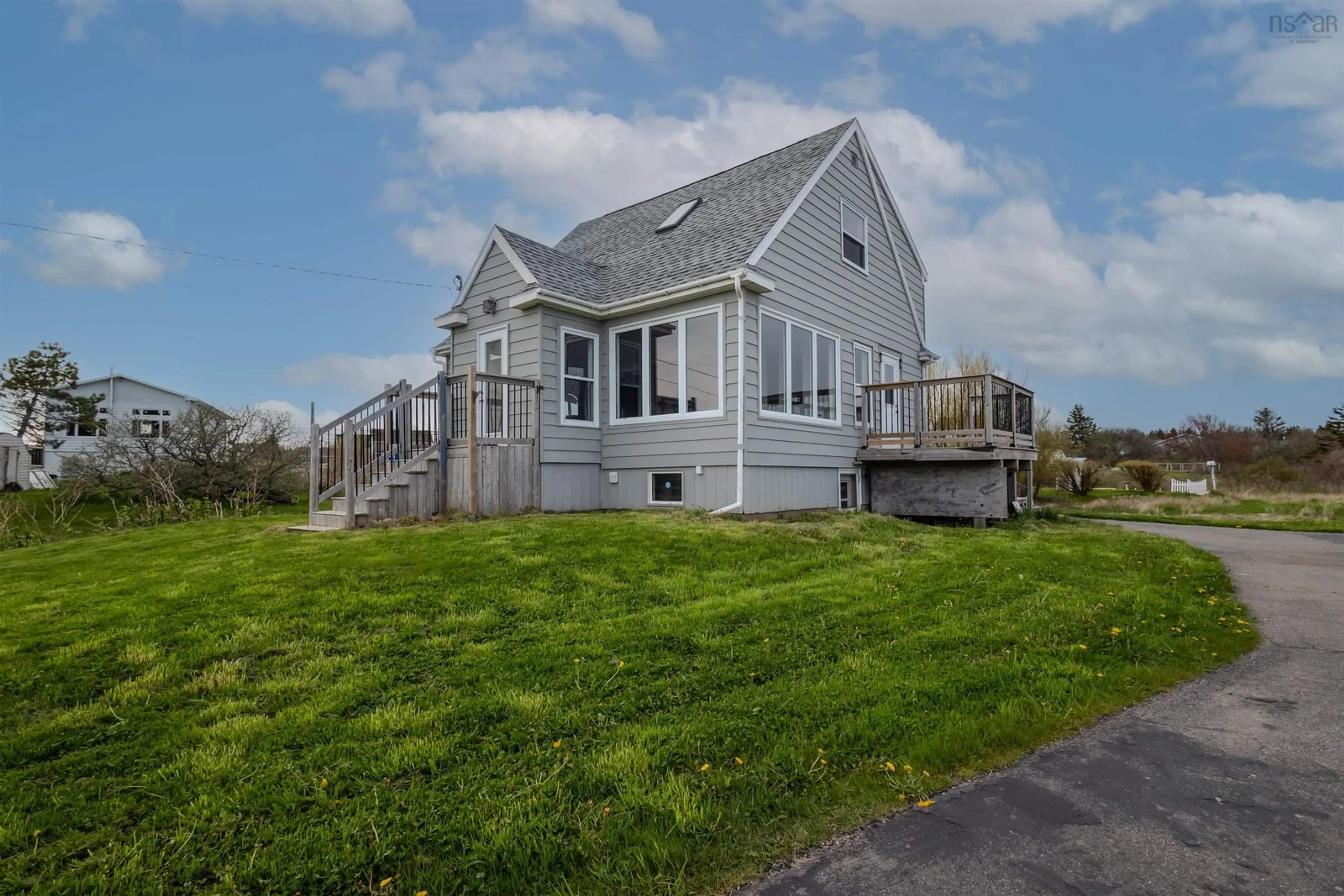 A pic from outside/outdoor area/front of a property/back of a property/a pic from drone, water/lake/river/ocean view for 59 Cliff St, Port Morien Nova Scotia B1B 1B4