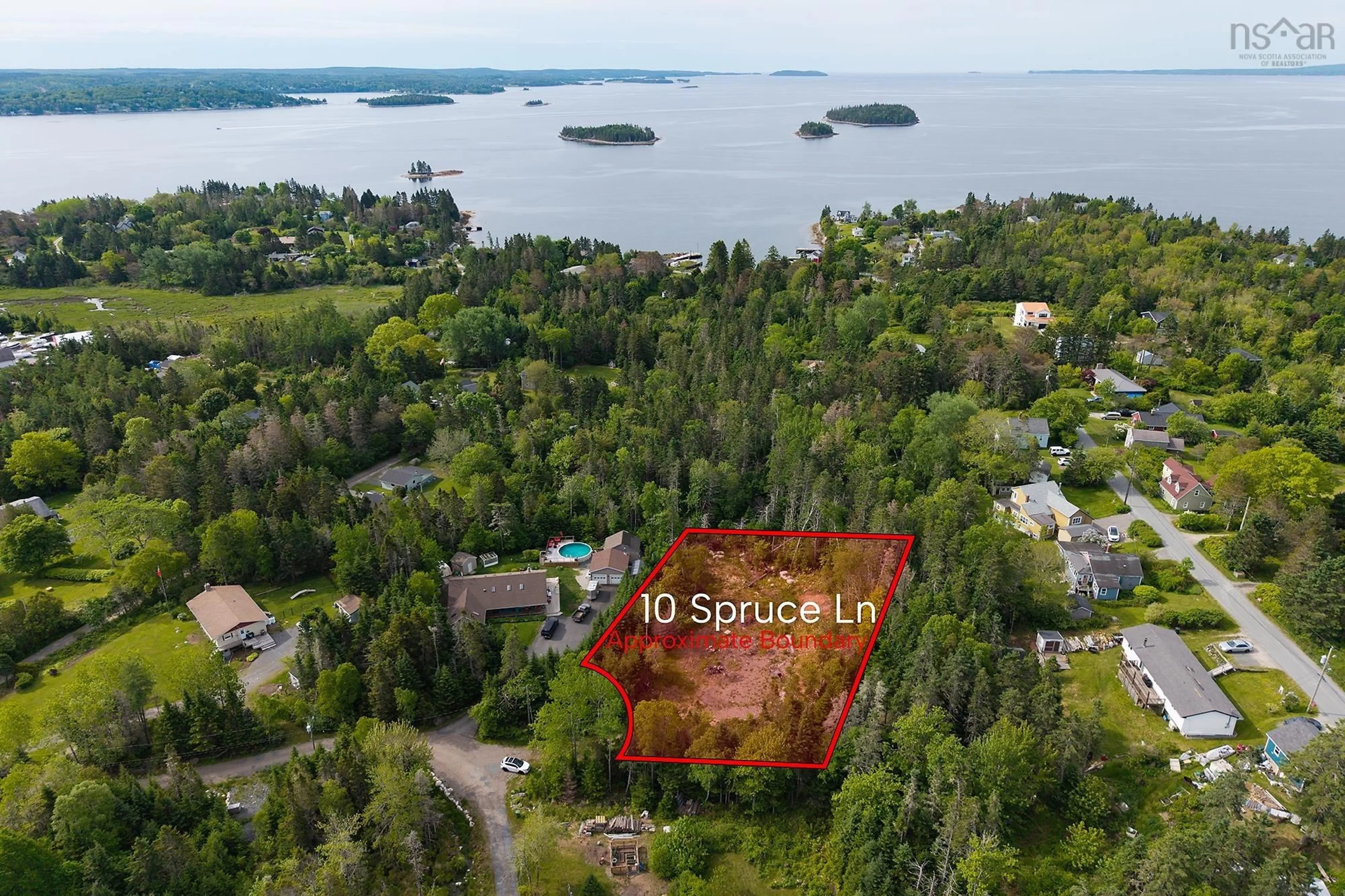 A pic from outside/outdoor area/front of a property/back of a property/a pic from drone, water/lake/river/ocean view for 10 Spruce Lane, Boutiliers Point Nova Scotia B3Z 4G8
