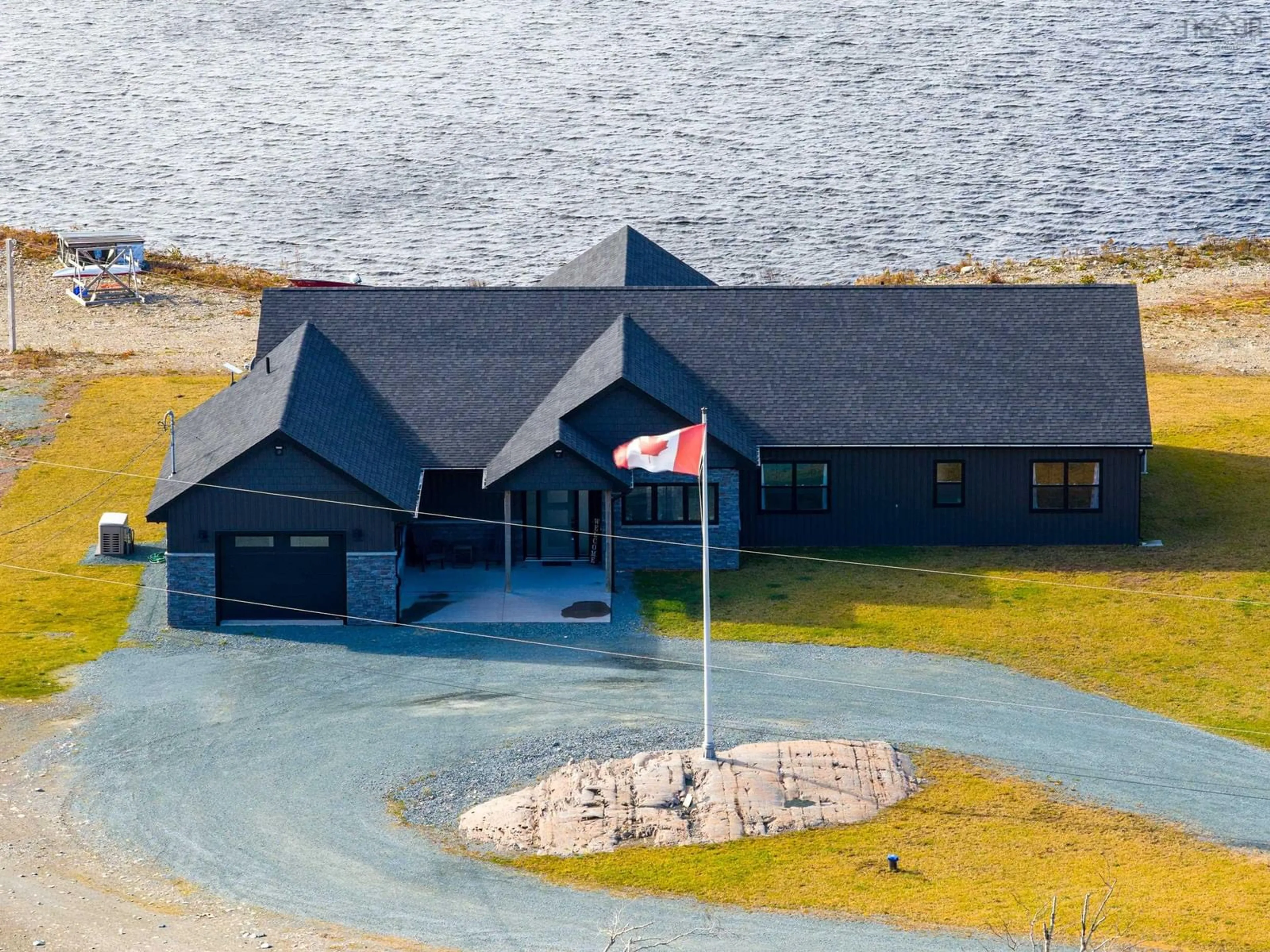 A pic from outside/outdoor area/front of a property/back of a property/a pic from drone, water/lake/river/ocean view for 5121 Clam Harbour Rd, Lake Charlotte Nova Scotia B0J 2L0