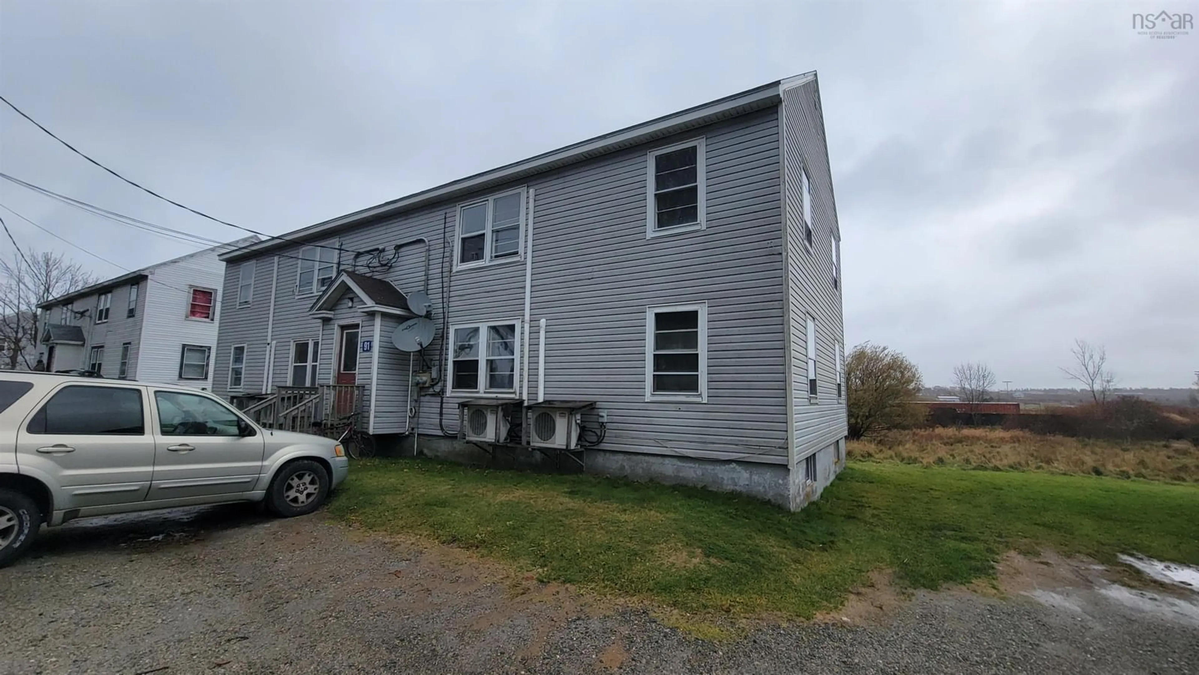 A pic from outside/outdoor area/front of a property/back of a property/a pic from drone, building for 91 Pleasant St, Yarmouth Nova Scotia B5A 2J3