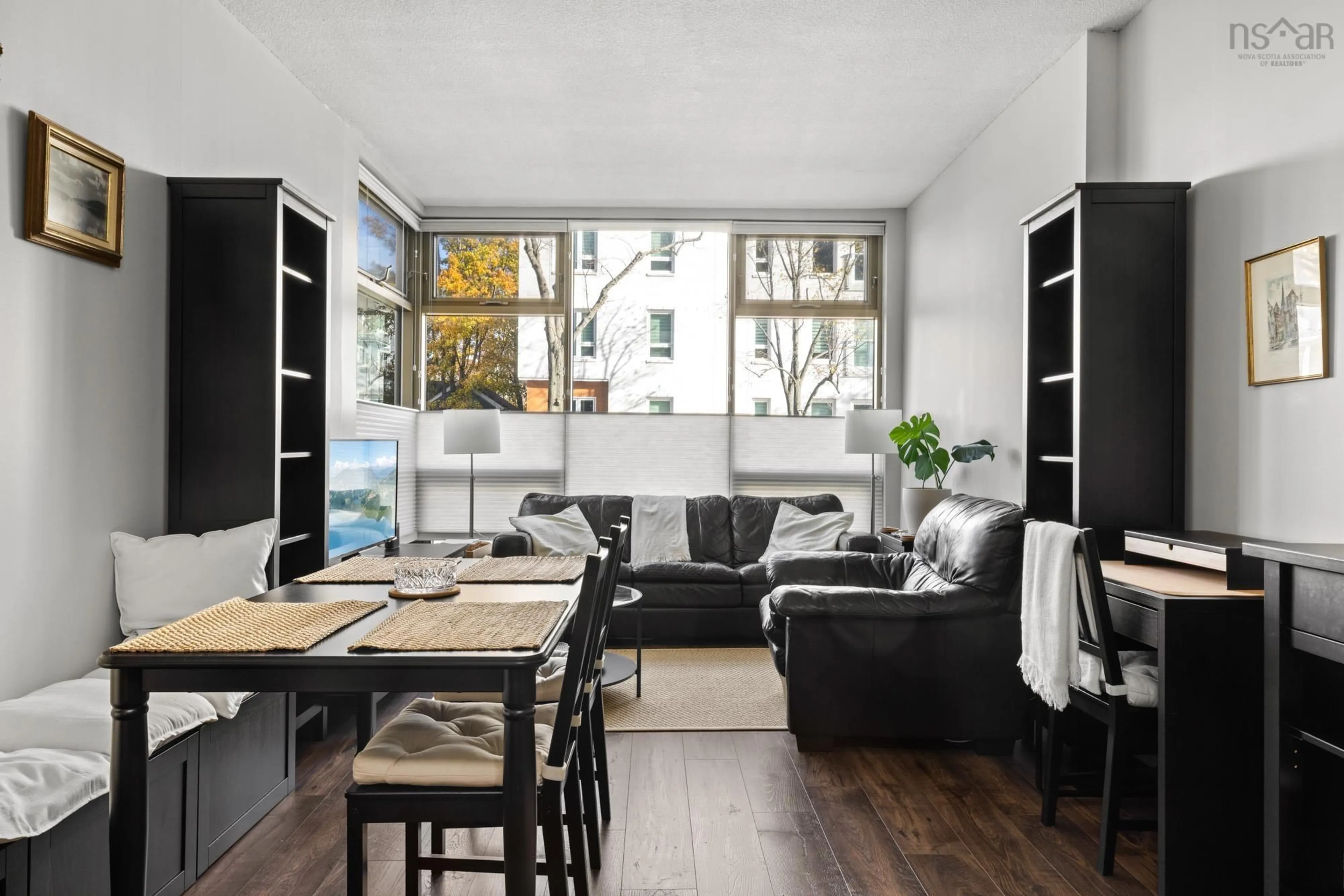 Living room with furniture, wood/laminate floor for 6369 Coburg Rd #202, Halifax Nova Scotia B3H 4J7