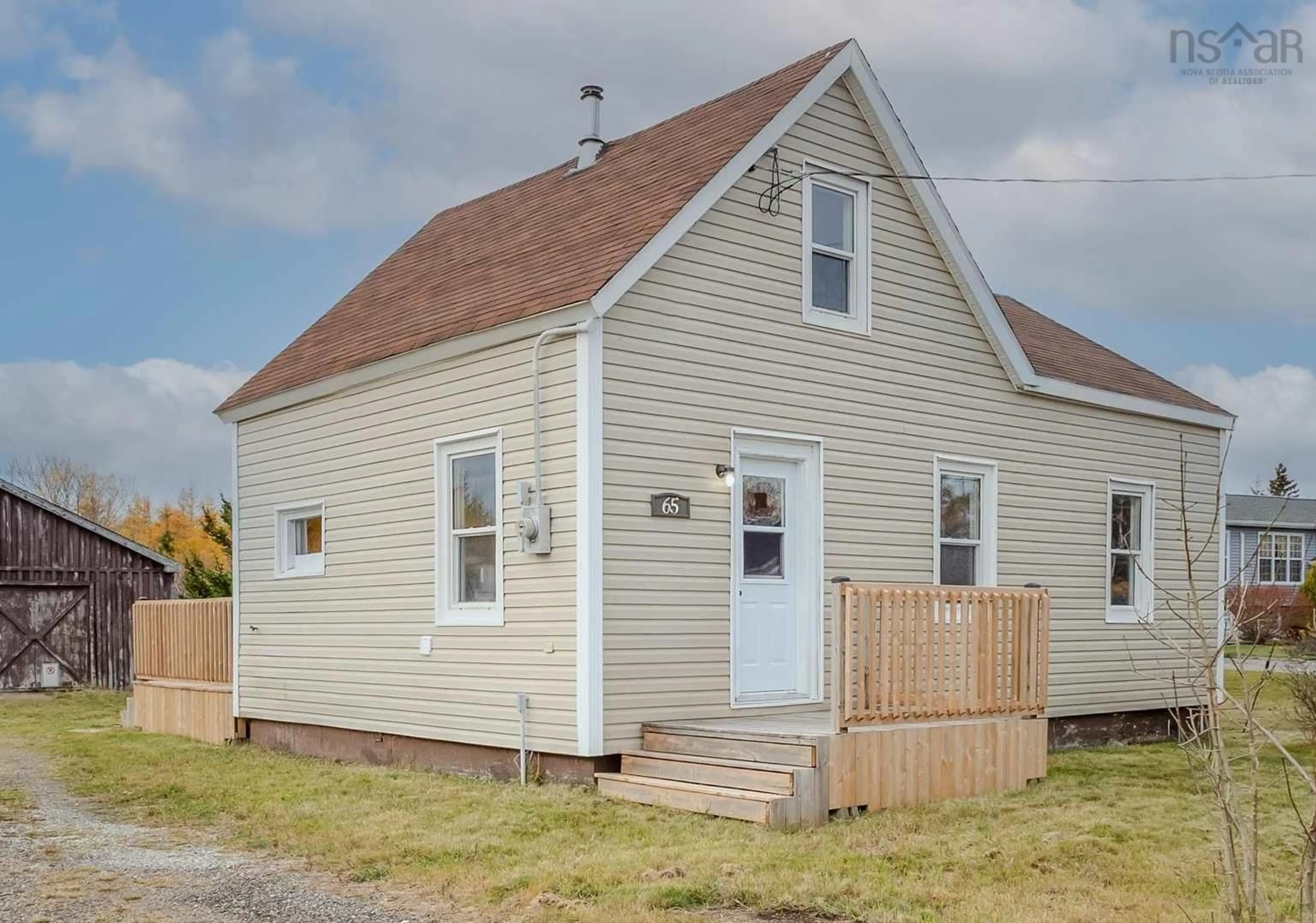 Home with vinyl exterior material, street for 65 Rear Main St, Reserve Mines Nova Scotia B1E 1H4