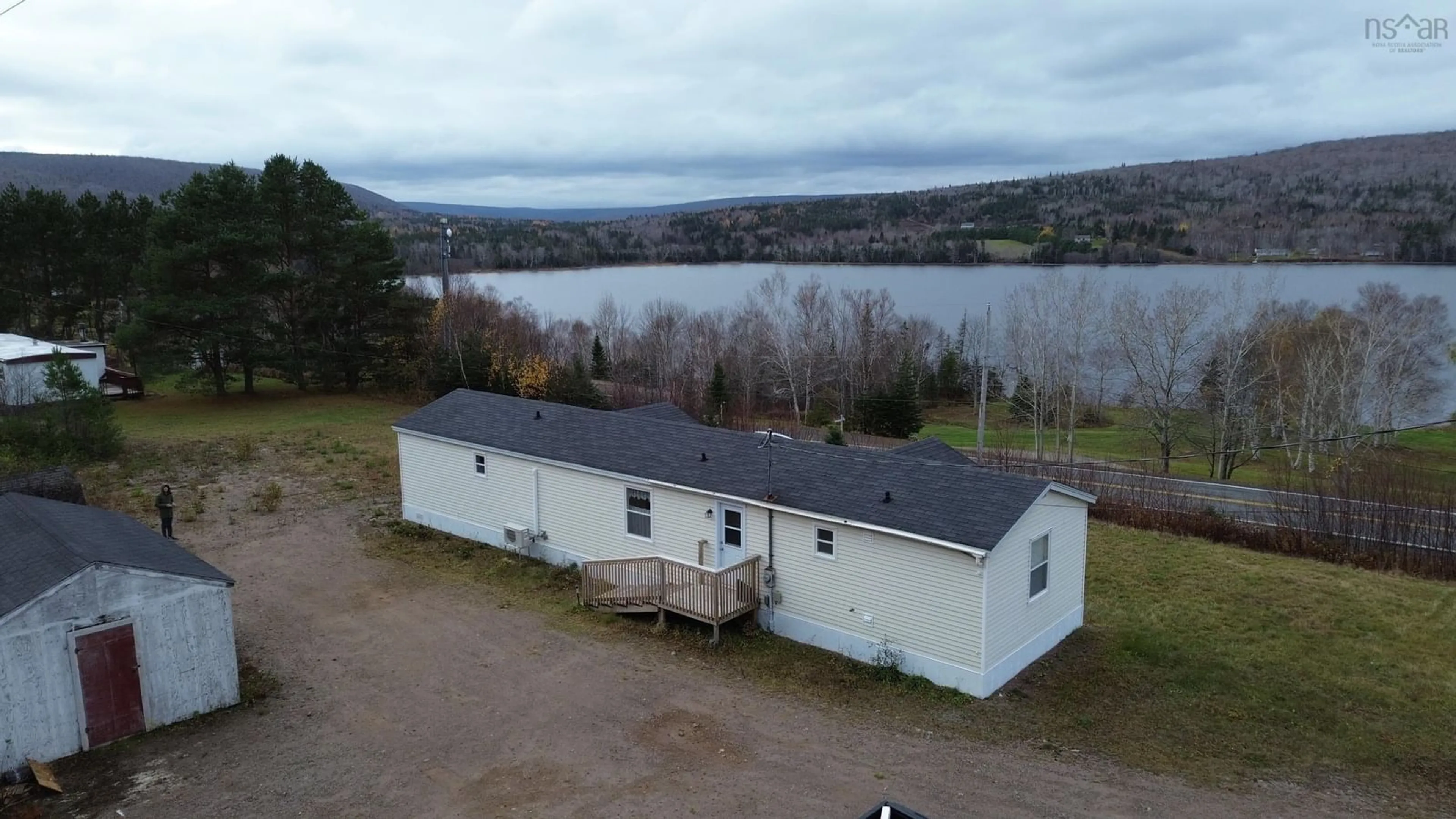 A pic from outside/outdoor area/front of a property/back of a property/a pic from drone, water/lake/river/ocean view for 1424 Highway 395, South Lake Ainslie Nova Scotia B0E 3M0