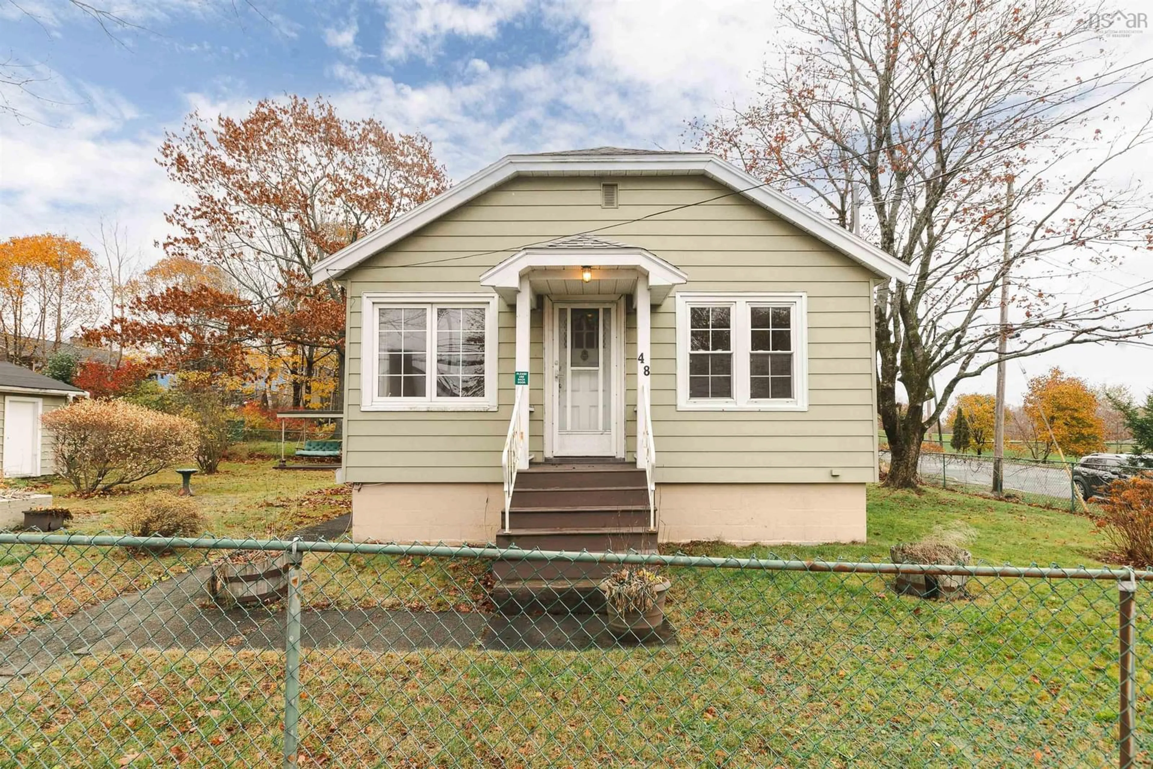 Home with vinyl exterior material, street for 48 Woodland Ave, Dartmouth Nova Scotia B3A 3J8