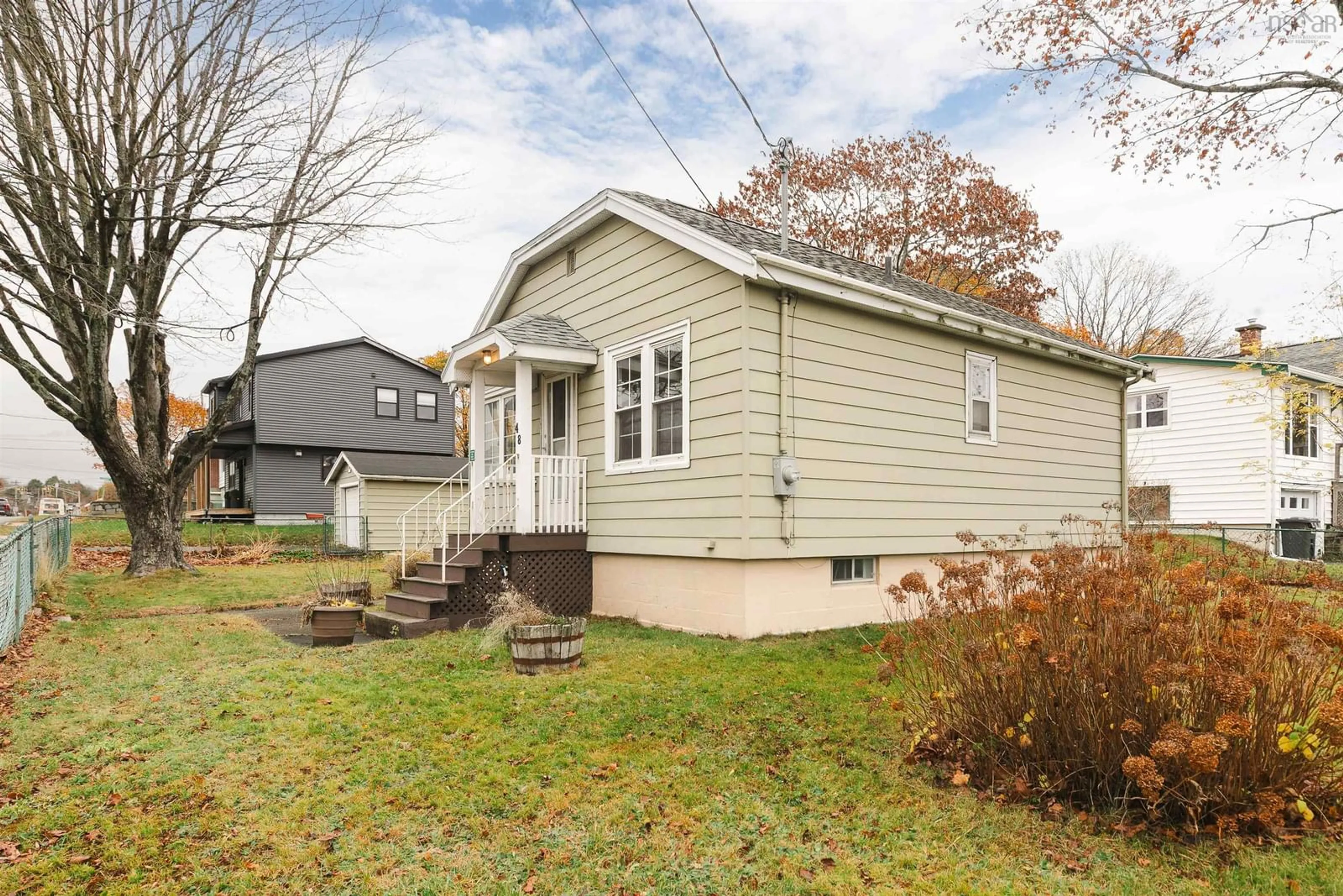 Home with vinyl exterior material, street for 48 Woodland Ave, Dartmouth Nova Scotia B3A 3J8