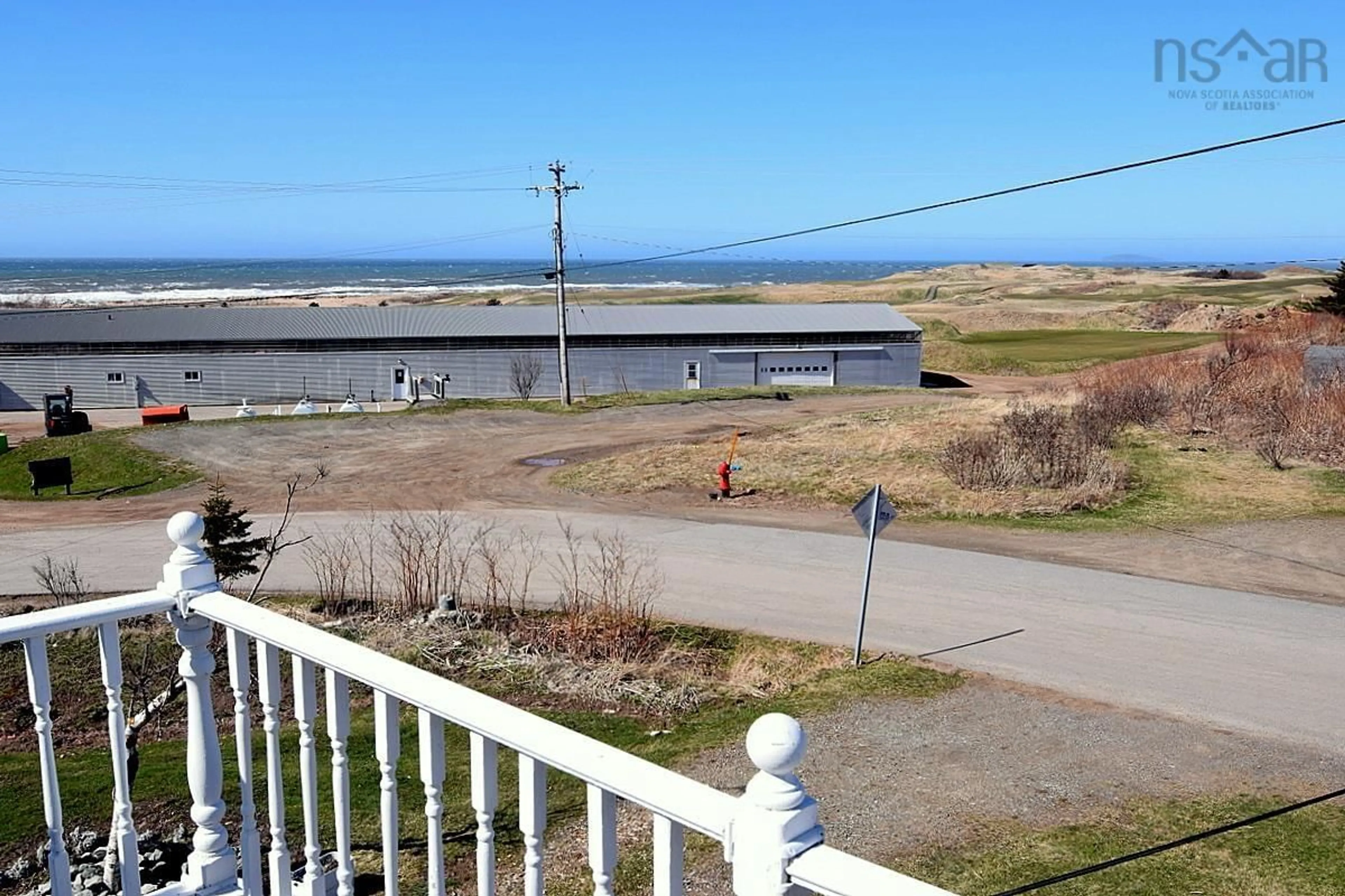 A pic from outside/outdoor area/front of a property/back of a property/a pic from drone, water/lake/river/ocean view for 43 Lower Railway St, Inverness Nova Scotia B0E 1N0