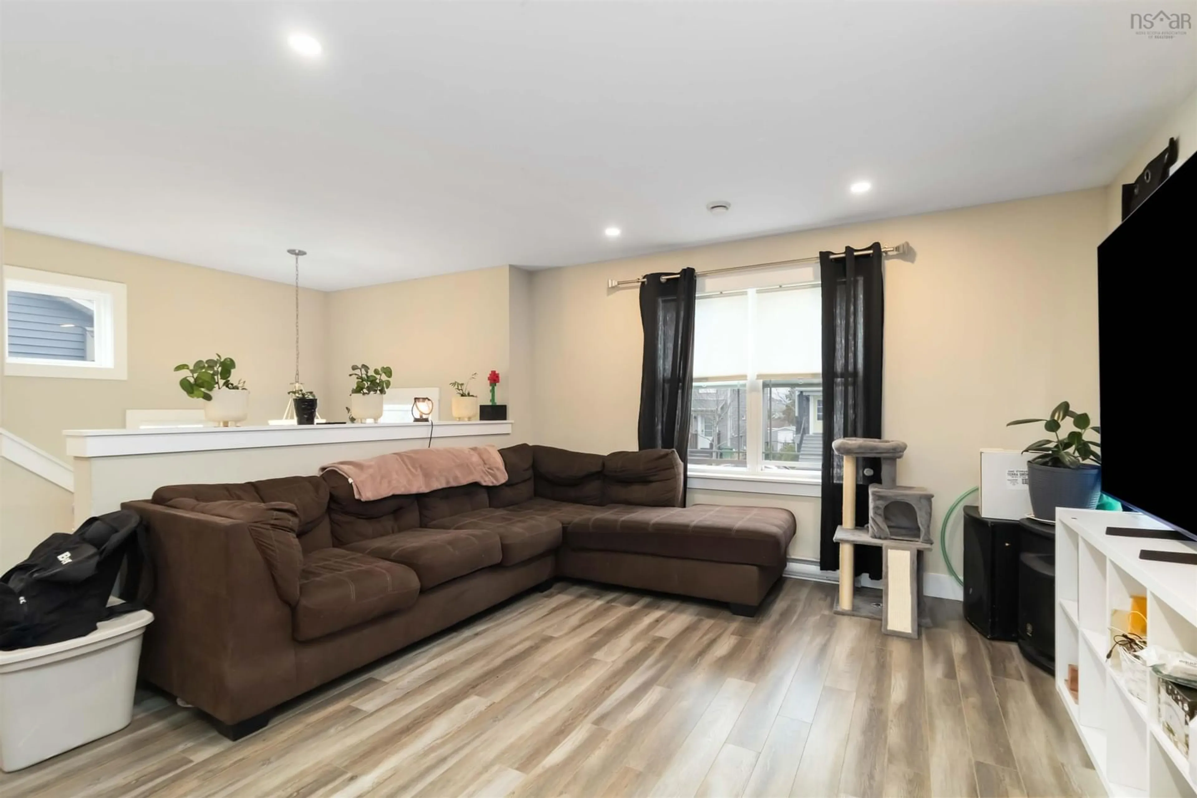 Living room with furniture, wood/laminate floor for 34 Boyne Crt, Eastern Passage Nova Scotia B3G 0H1