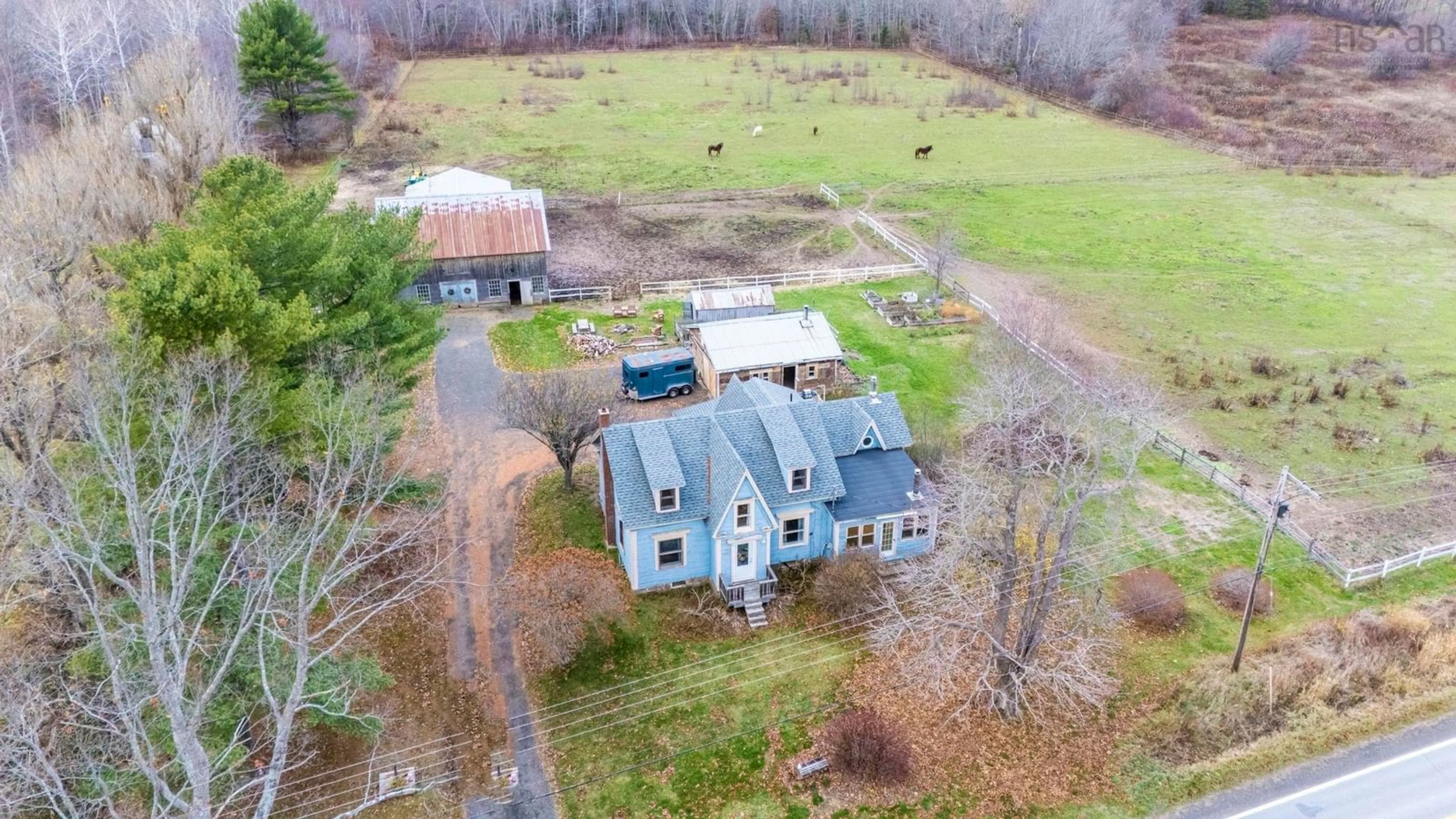 A pic from outside/outdoor area/front of a property/back of a property/a pic from drone, building for 9991 Highway 1, Paradise Nova Scotia B0S 1C0
