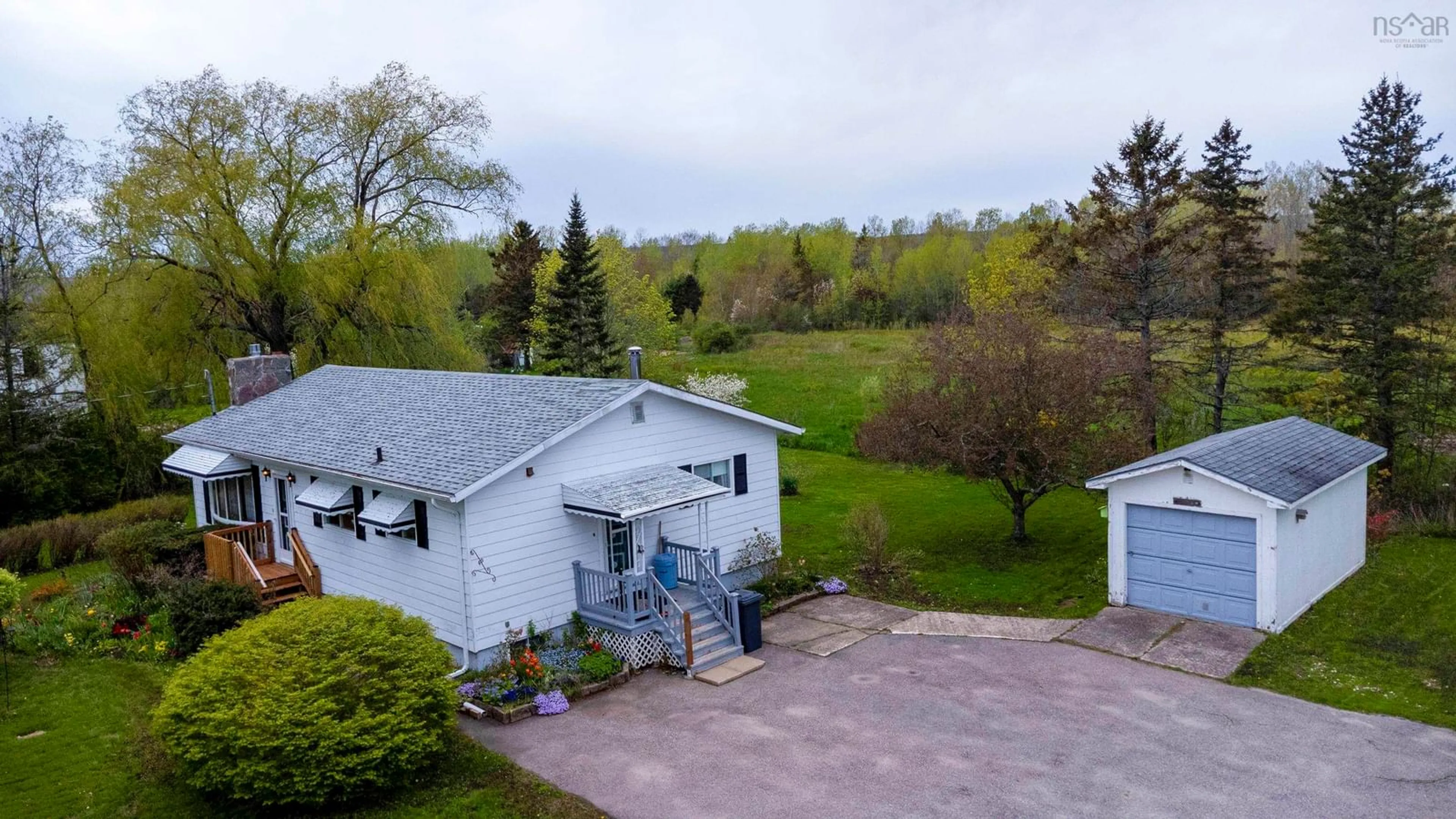 A pic from outside/outdoor area/front of a property/back of a property/a pic from drone, unknown for 683 Main St, Lawrencetown Nova Scotia B0S 1M0