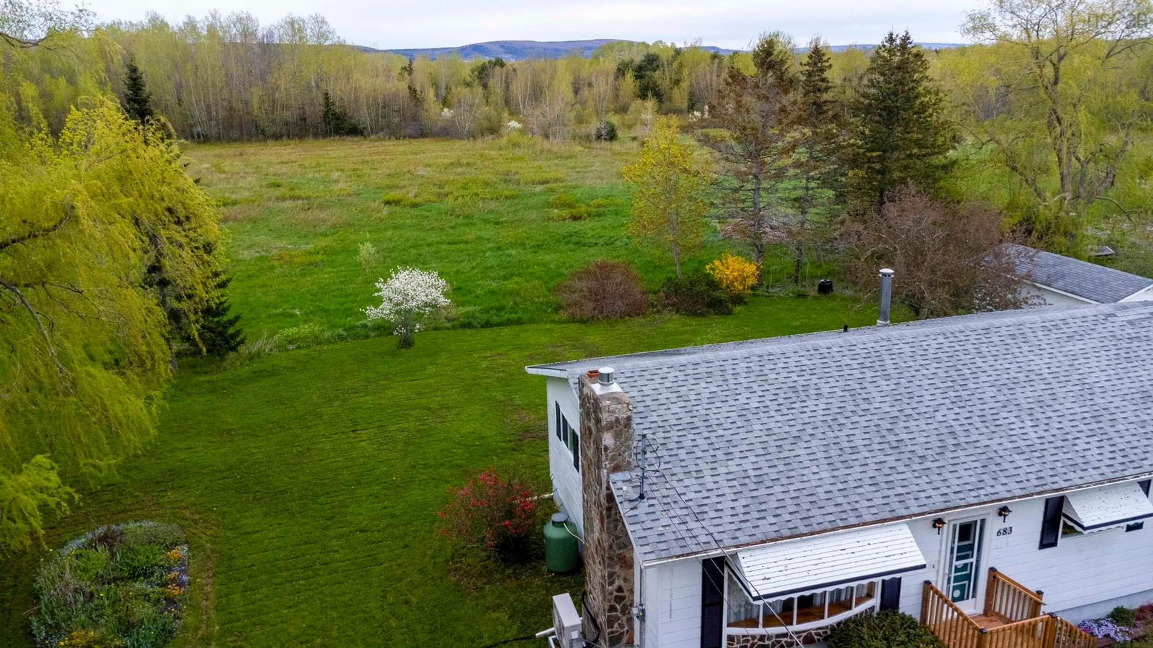 A pic from outside/outdoor area/front of a property/back of a property/a pic from drone, unknown for 683 Main St, Lawrencetown Nova Scotia B0S 1M0