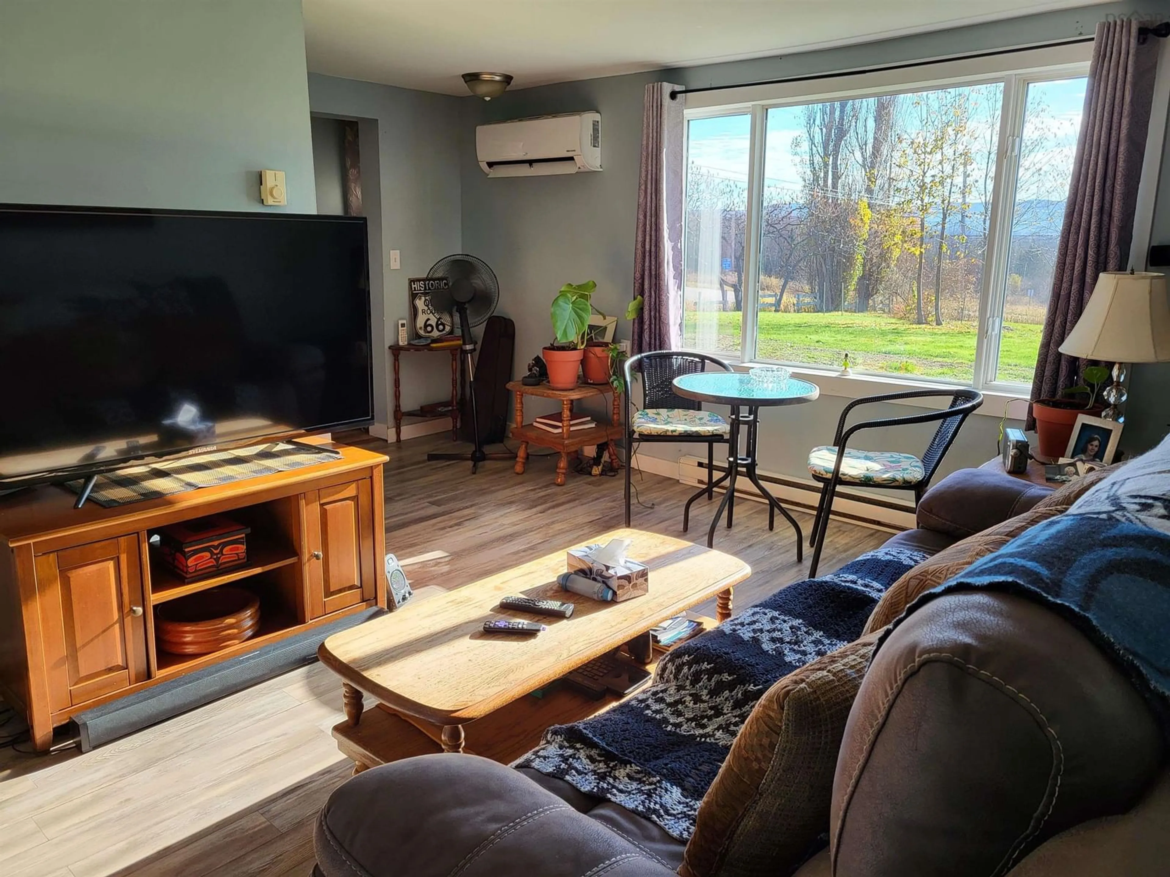 Living room with furniture, wood/laminate floor for 519 Inglewood Rd, Beaconsfield Nova Scotia B0S 1C0