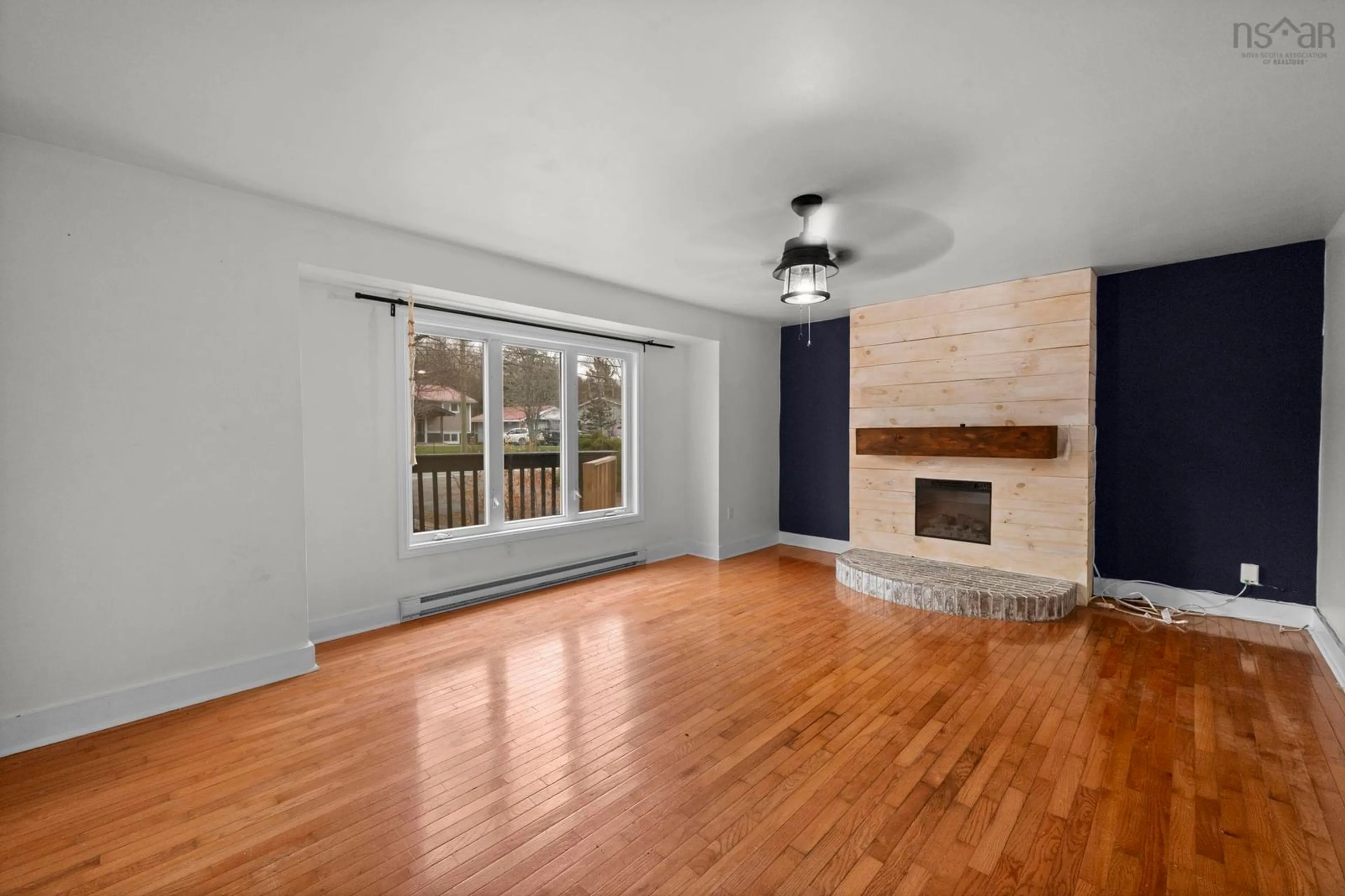 Living room with furniture, wood/laminate floor for 687 Waverley Rd, Dartmouth Nova Scotia B2X 2Y7
