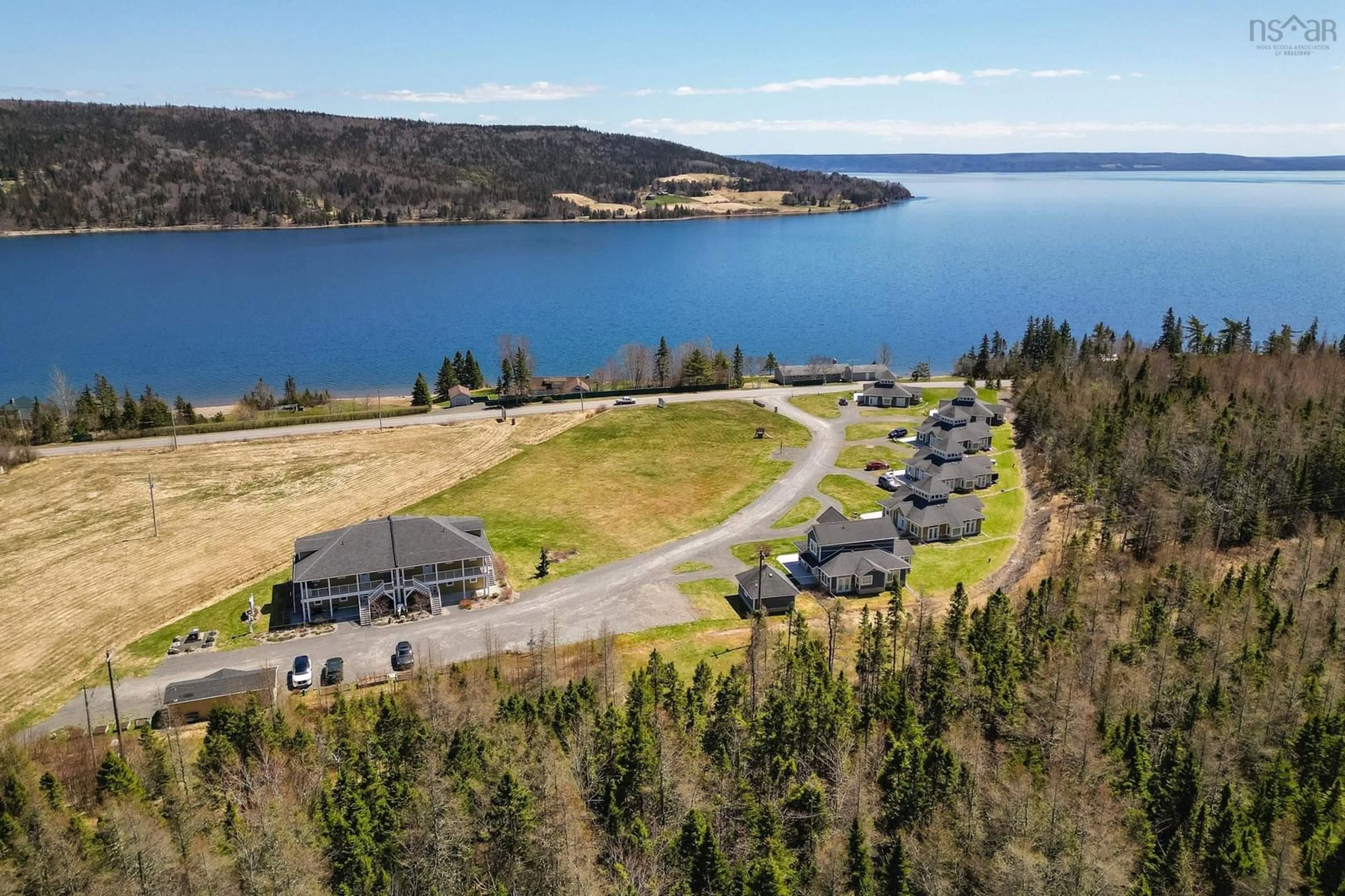 A pic from outside/outdoor area/front of a property/back of a property/a pic from drone, water/lake/river/ocean view for 7 Bell Bay Way, Baddeck Nova Scotia B0C 1H0