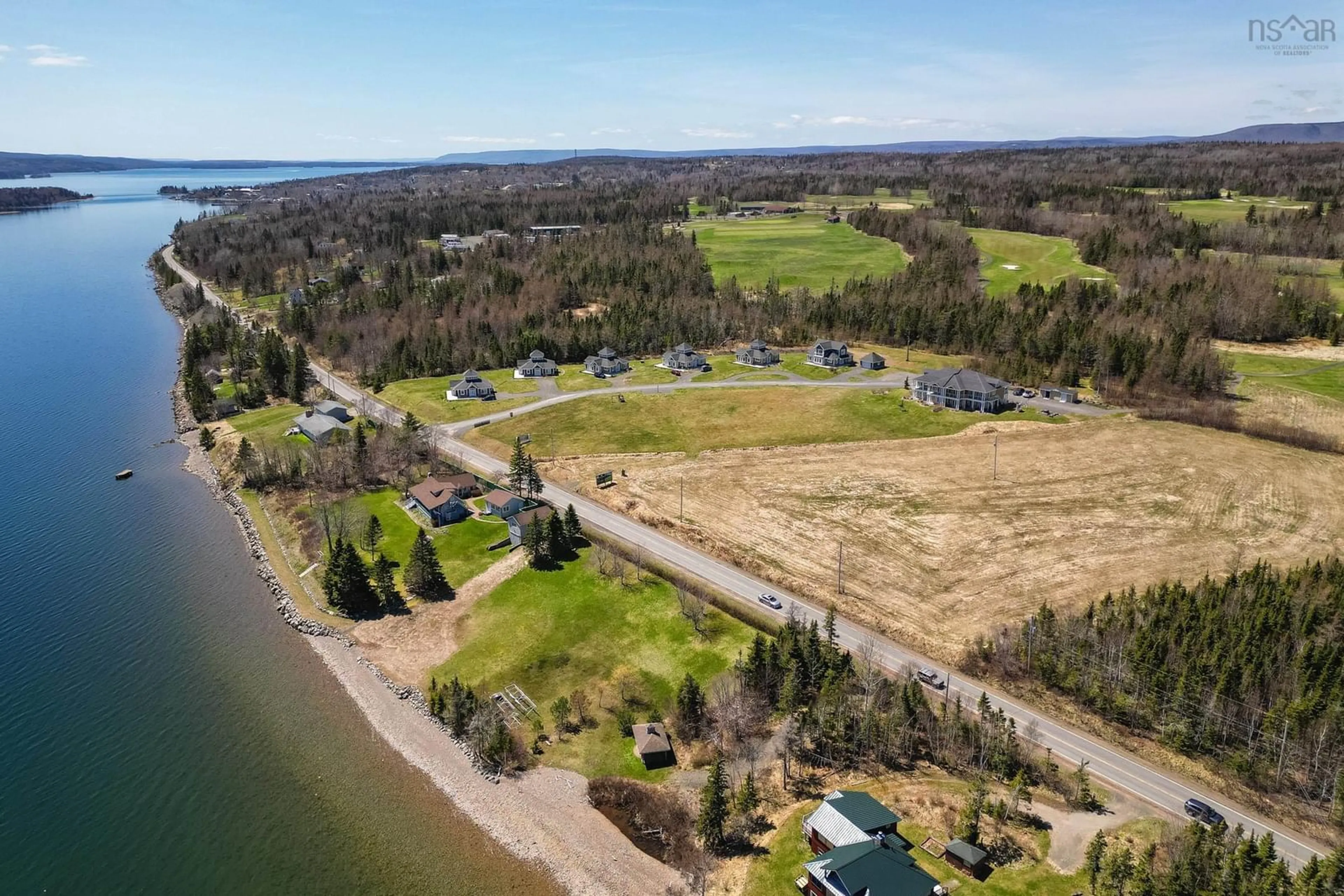 A pic from outside/outdoor area/front of a property/back of a property/a pic from drone, water/lake/river/ocean view for 7 Bell Bay Way, Baddeck Nova Scotia B0C 1H0