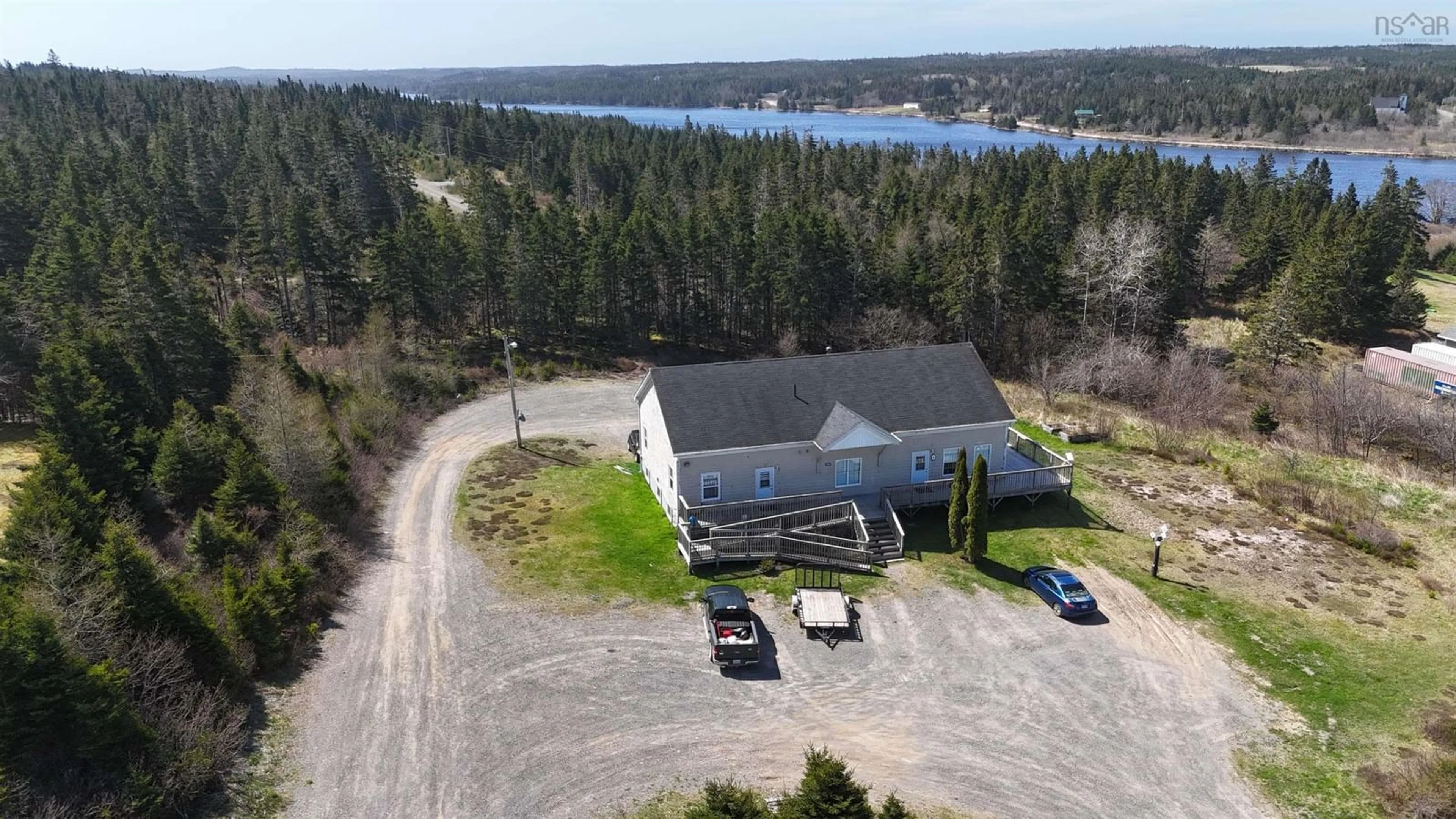 A pic from outside/outdoor area/front of a property/back of a property/a pic from drone, water/lake/river/ocean view for 1826 St Peters Fourchu Rd, Grand River Nova Scotia B0E 1M0