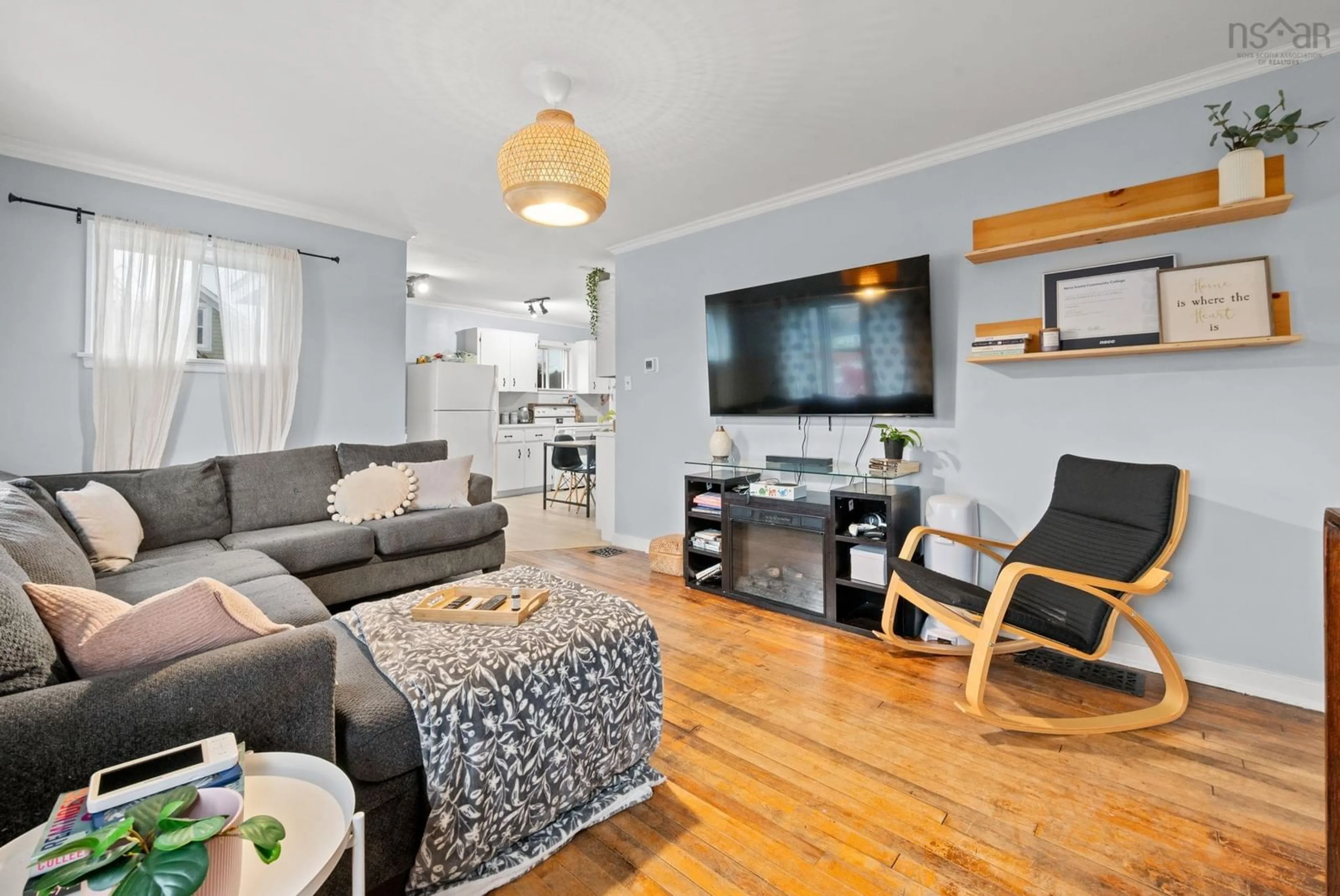 Living room with furniture, wood/laminate floor for 13935 Highway 1, Hants Border Nova Scotia B0P 1P0