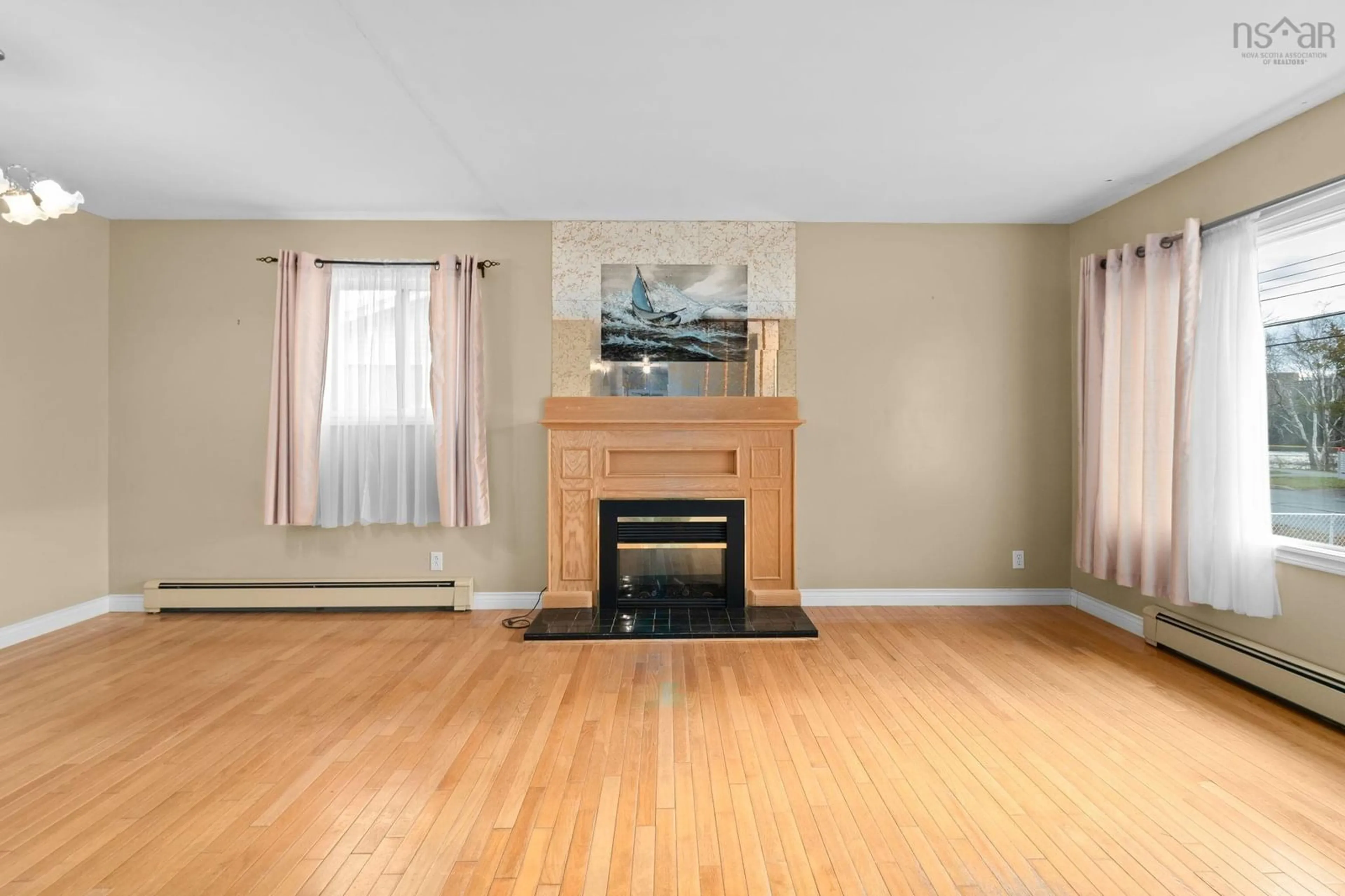 Living room with furniture, wood/laminate floor for 47 Penhorn Dr, Dartmouth Nova Scotia B2Y 3K4