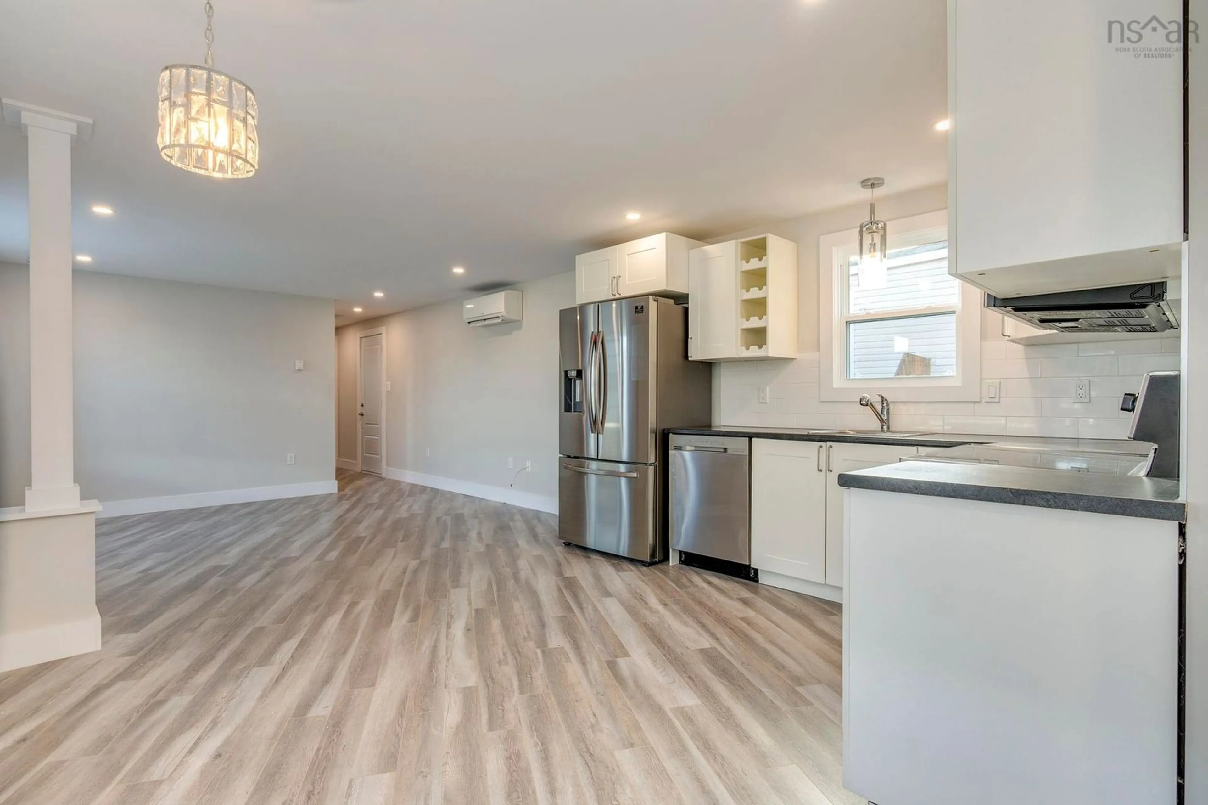 Open concept kitchen, wood/laminate floor for 406 Glen Rise Dr, Beaver Bank Nova Scotia B4E 1M3