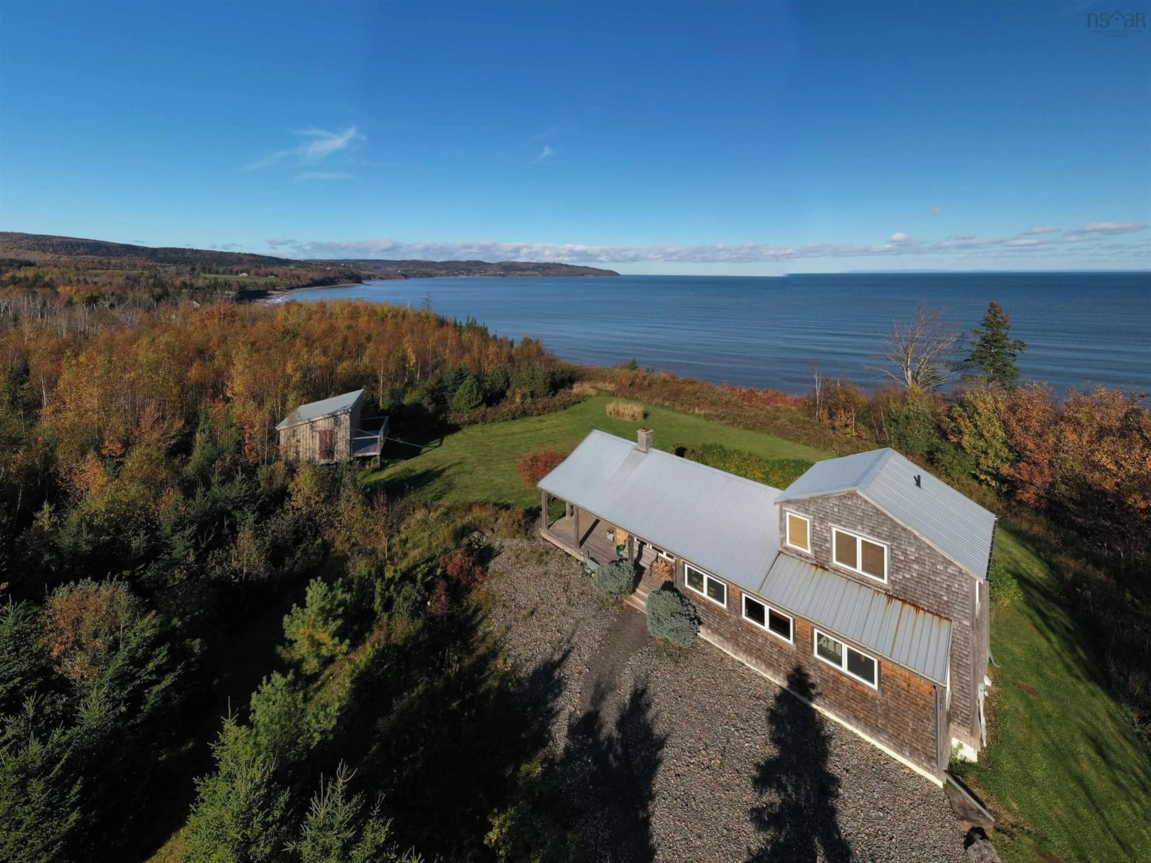 A pic from outside/outdoor area/front of a property/back of a property/a pic from drone, water/lake/river/ocean view for 5412 Highway 337 Cape George, Cape George Nova Scotia B2G 2L2