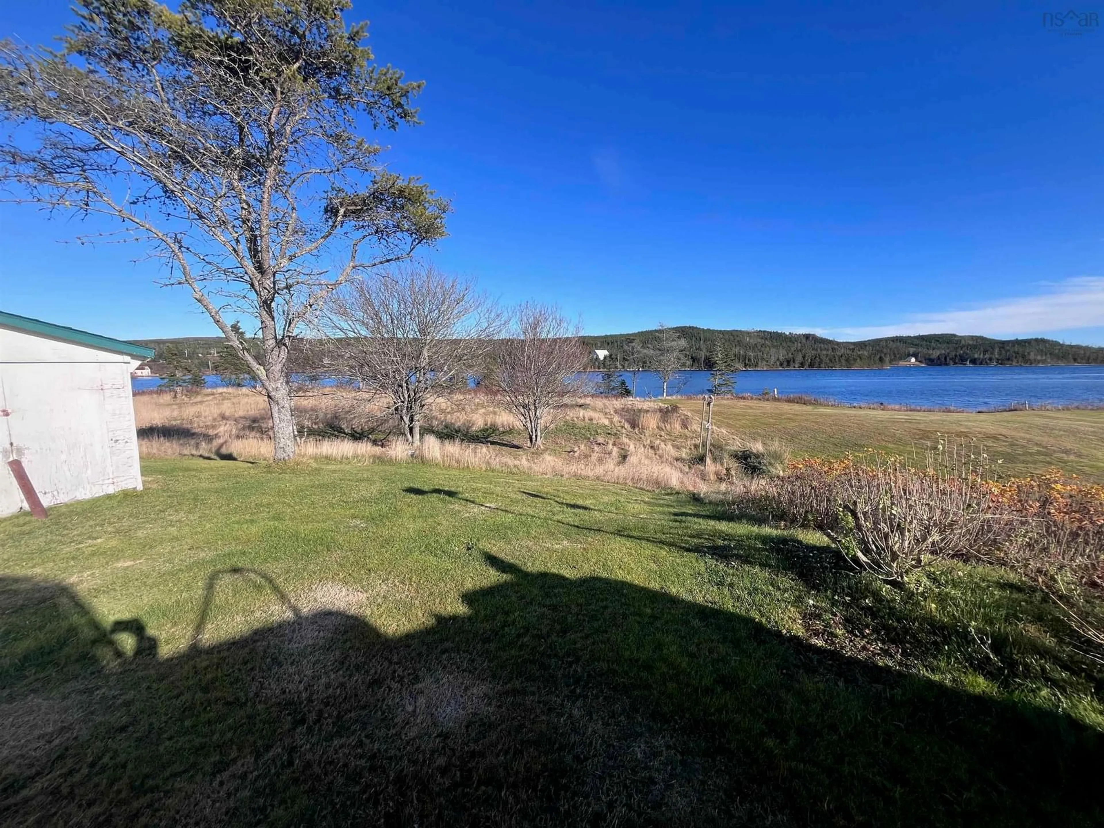 A pic from outside/outdoor area/front of a property/back of a property/a pic from drone, water/lake/river/ocean view for 28 Sangster Road, New Harbour Nova Scotia B0H 1T0