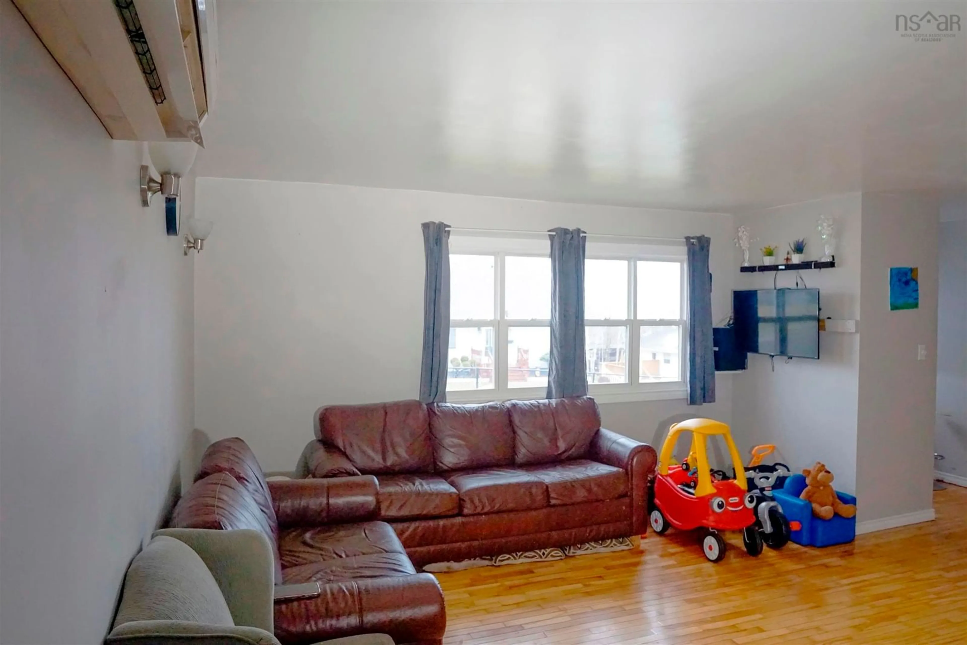 Living room with furniture, unknown for 32 Common St, Sydney Nova Scotia B1P 3L1