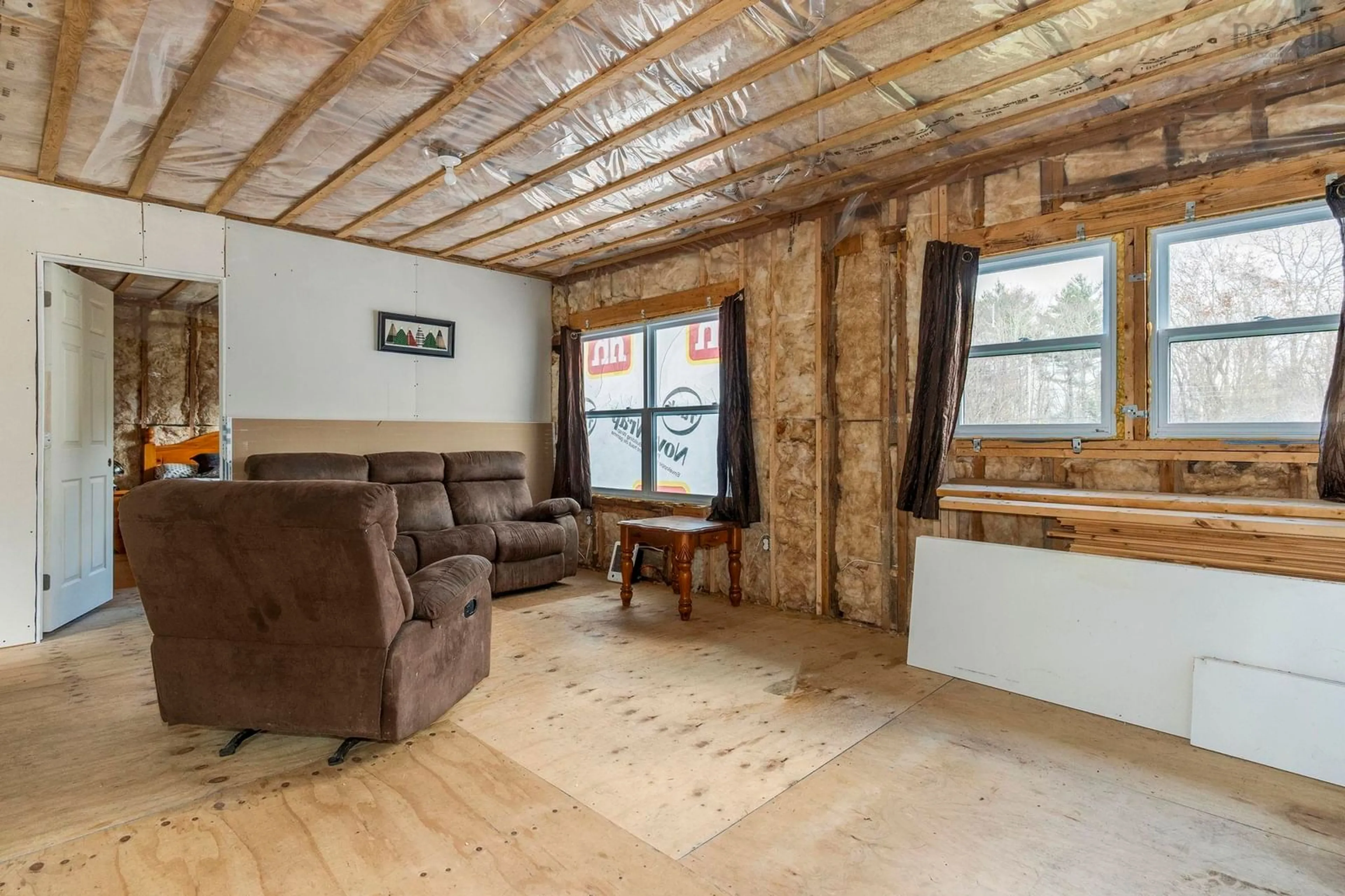 Living room with furniture, wood/laminate floor for 741 Westfield Rd, Westfield Nova Scotia B0T 1B0