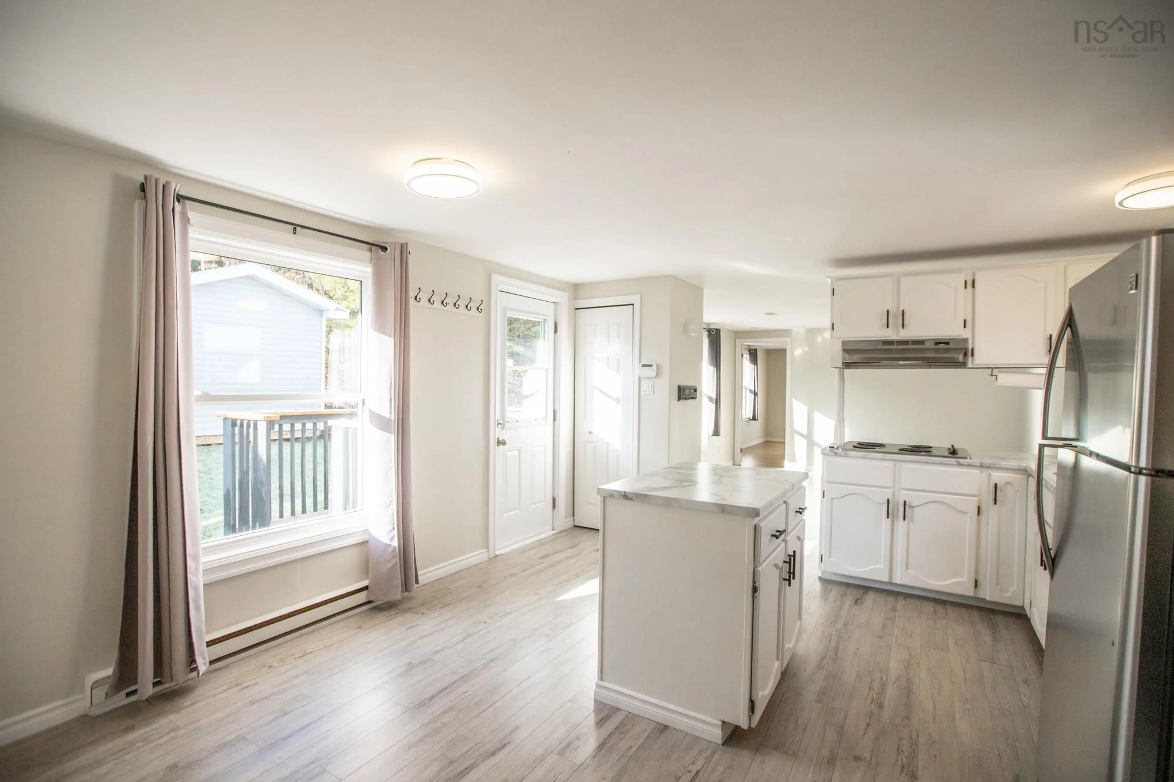 Open concept kitchen, wood/laminate floor for 21 Wagner Dr, Middle Sackville Nova Scotia B4E 2Z1