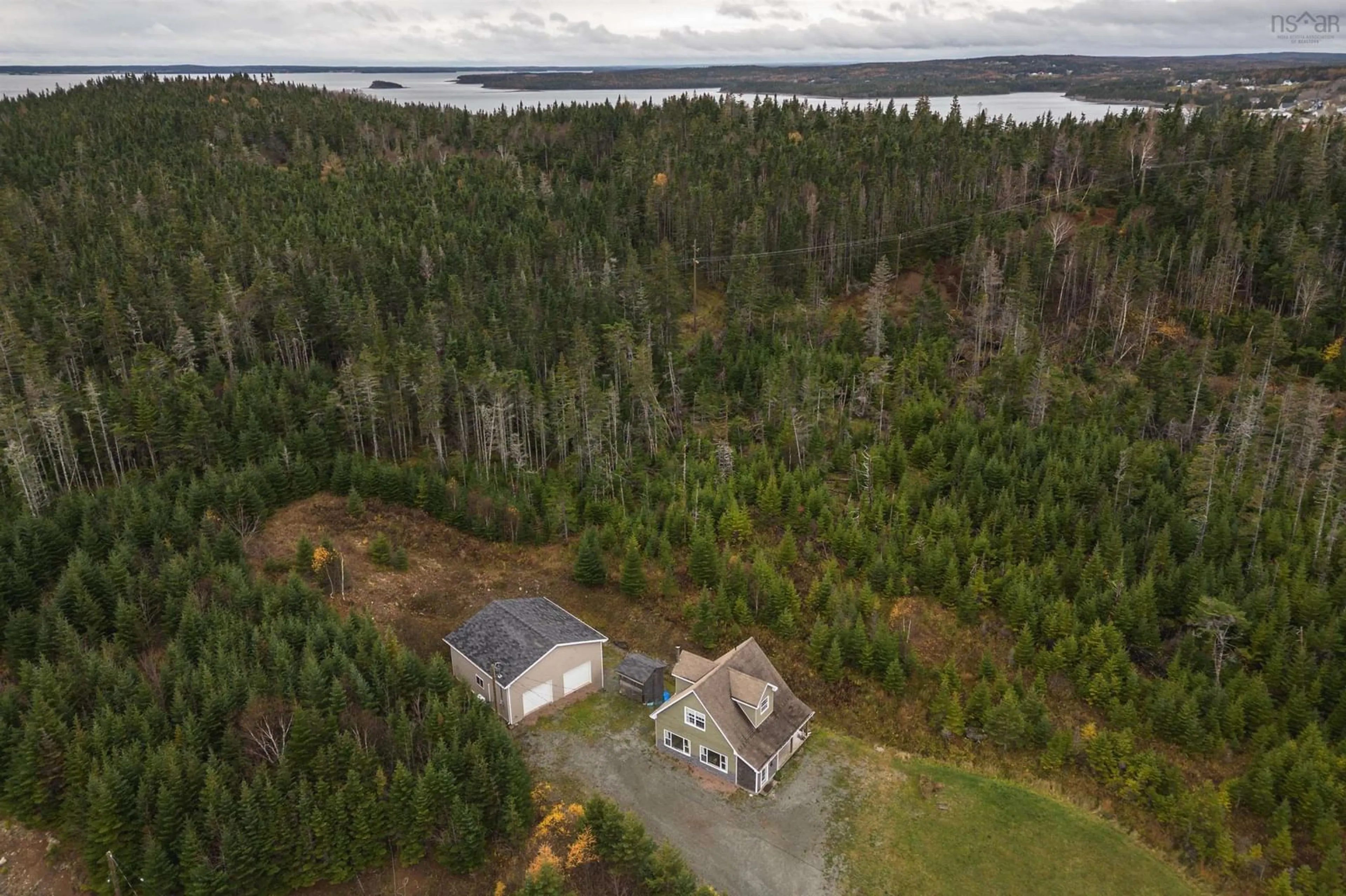 A pic from outside/outdoor area/front of a property/back of a property/a pic from drone, water/lake/river/ocean view for 10198 Grenville St, St. Peter's Nova Scotia B0E 3B0